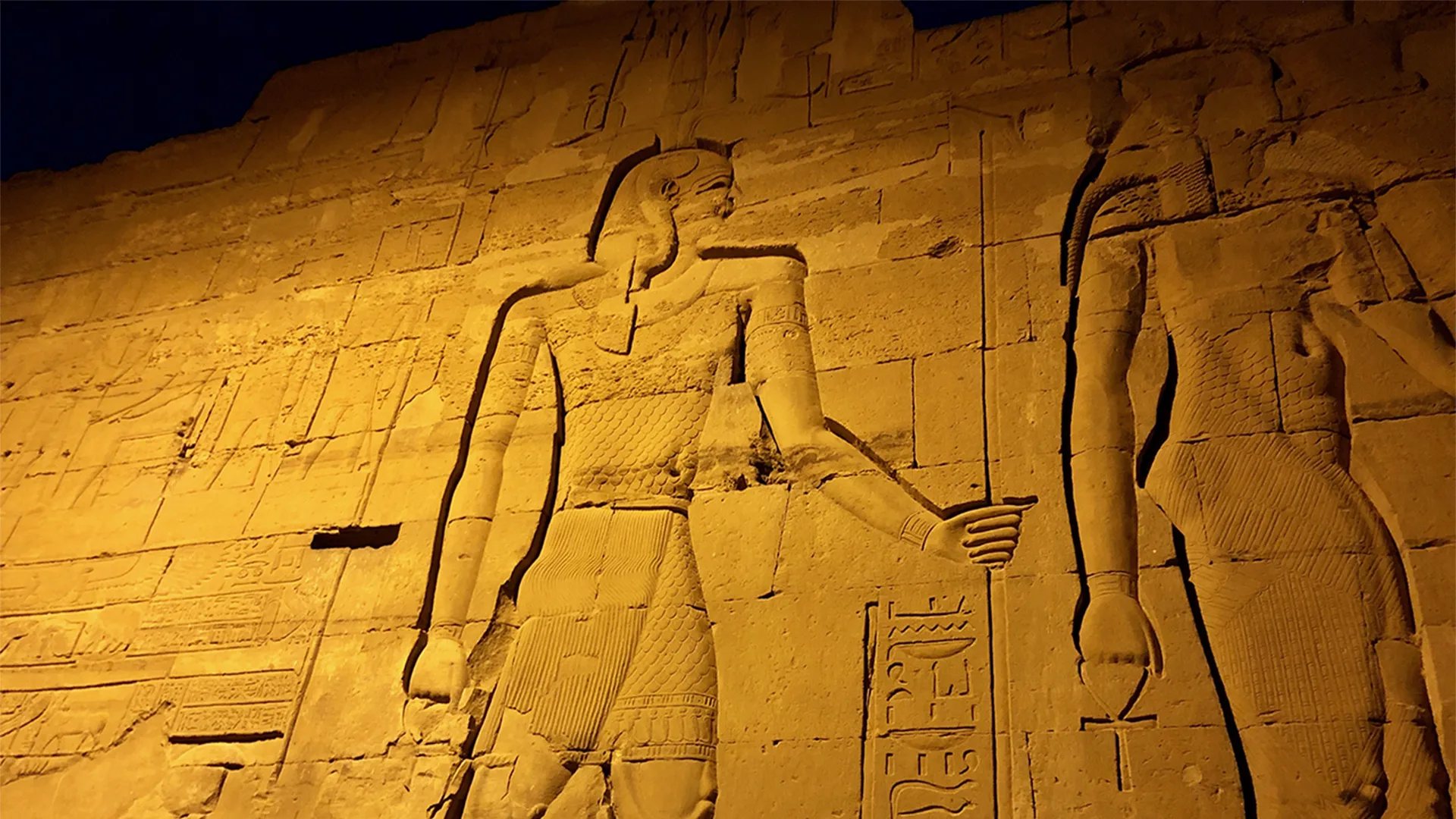 Large wall carvings of Egyptian royalty