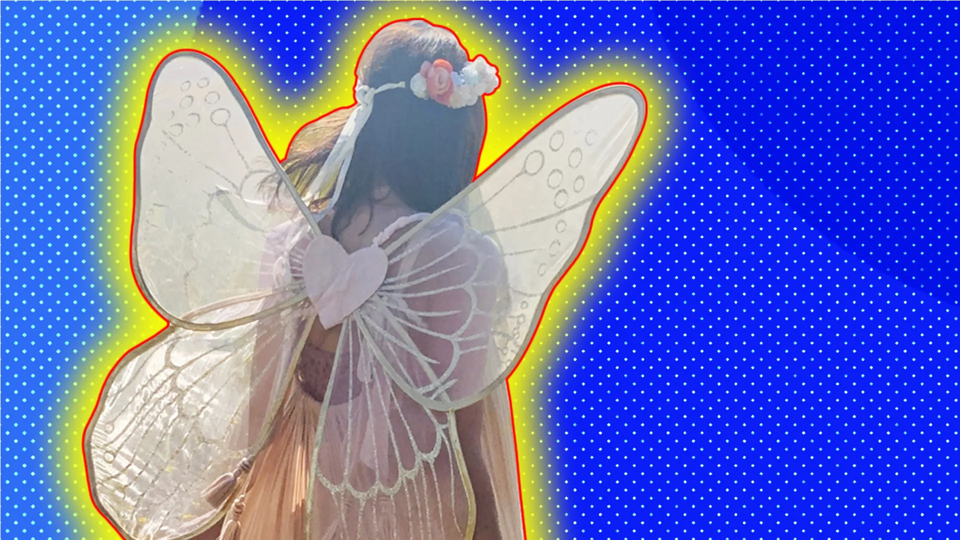Fairy costume from the back with a polkadot background and a glow around the image