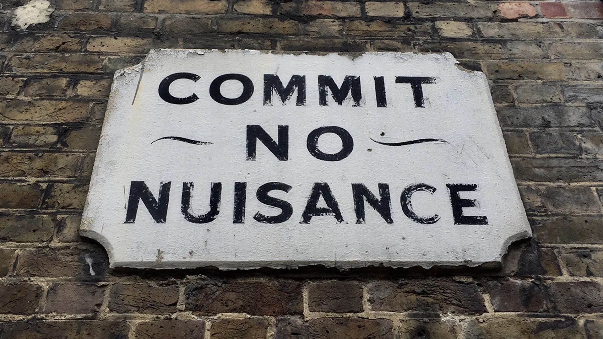 A sign that reads: 'commit no nuisance'