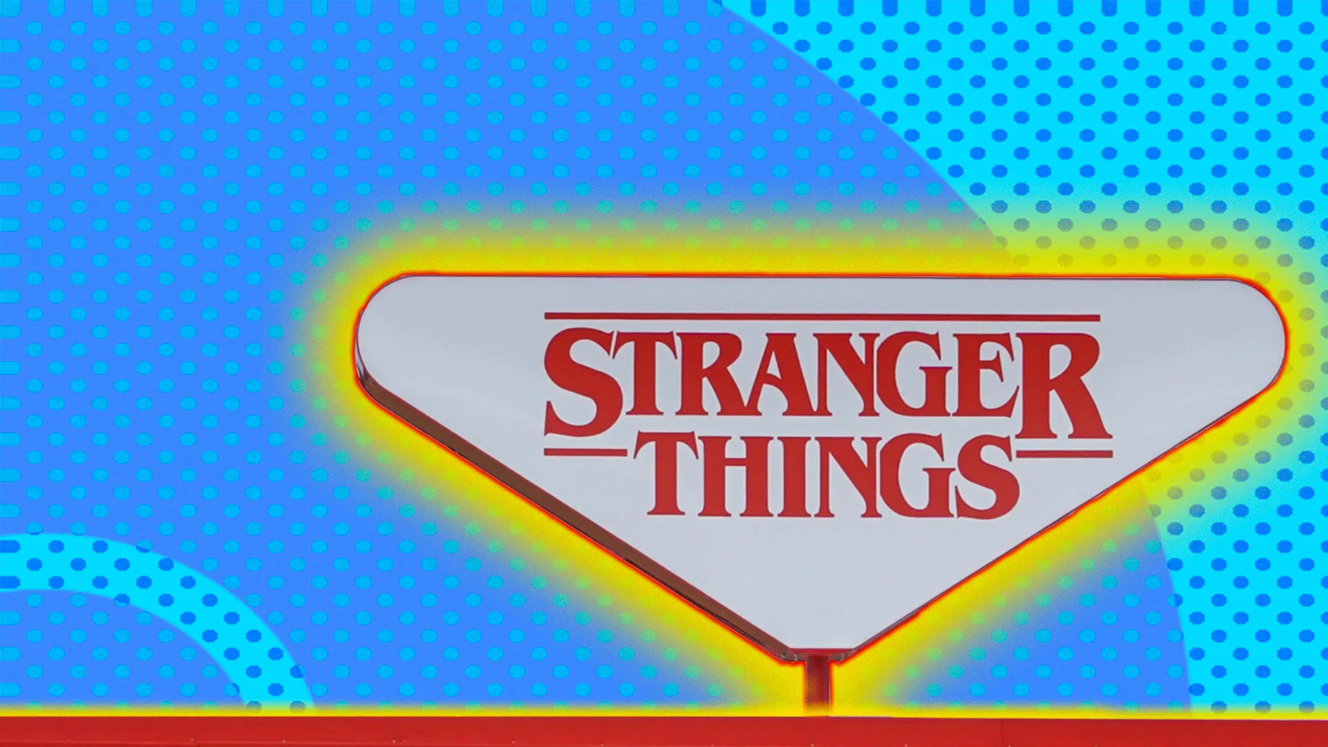 Stranger things sign on top of a building with a polkadot background and a glow around the image