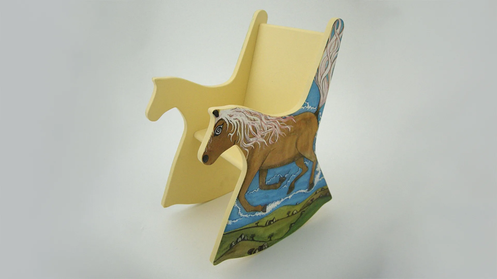 Wooden doll-sized rocking chair with horse illustration