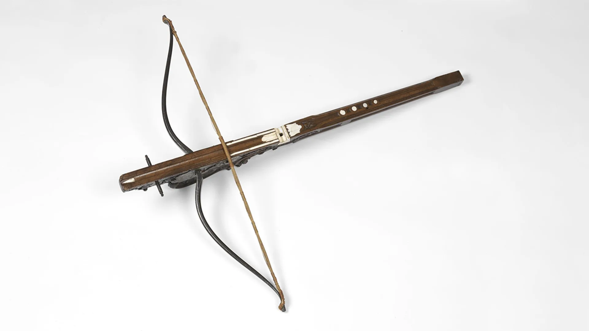 Wooden crossbow on white background.