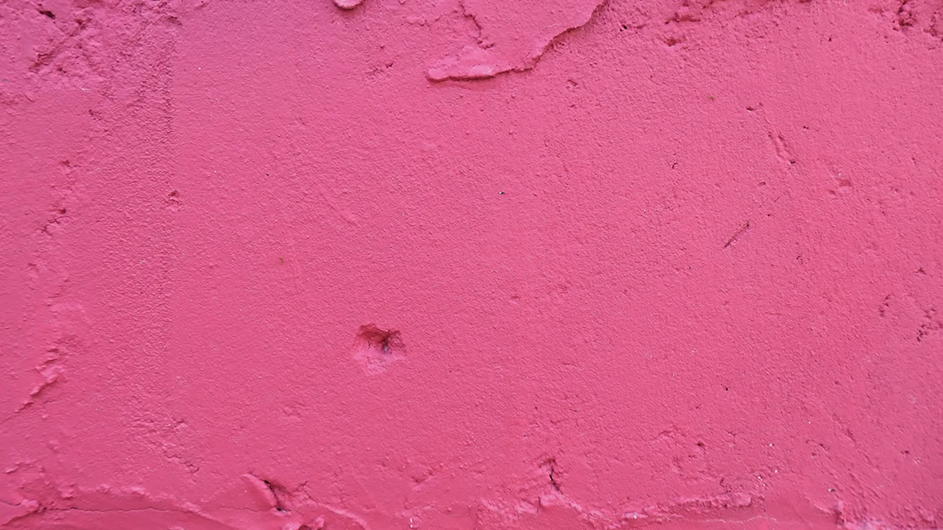 Close up of a bright pink wall