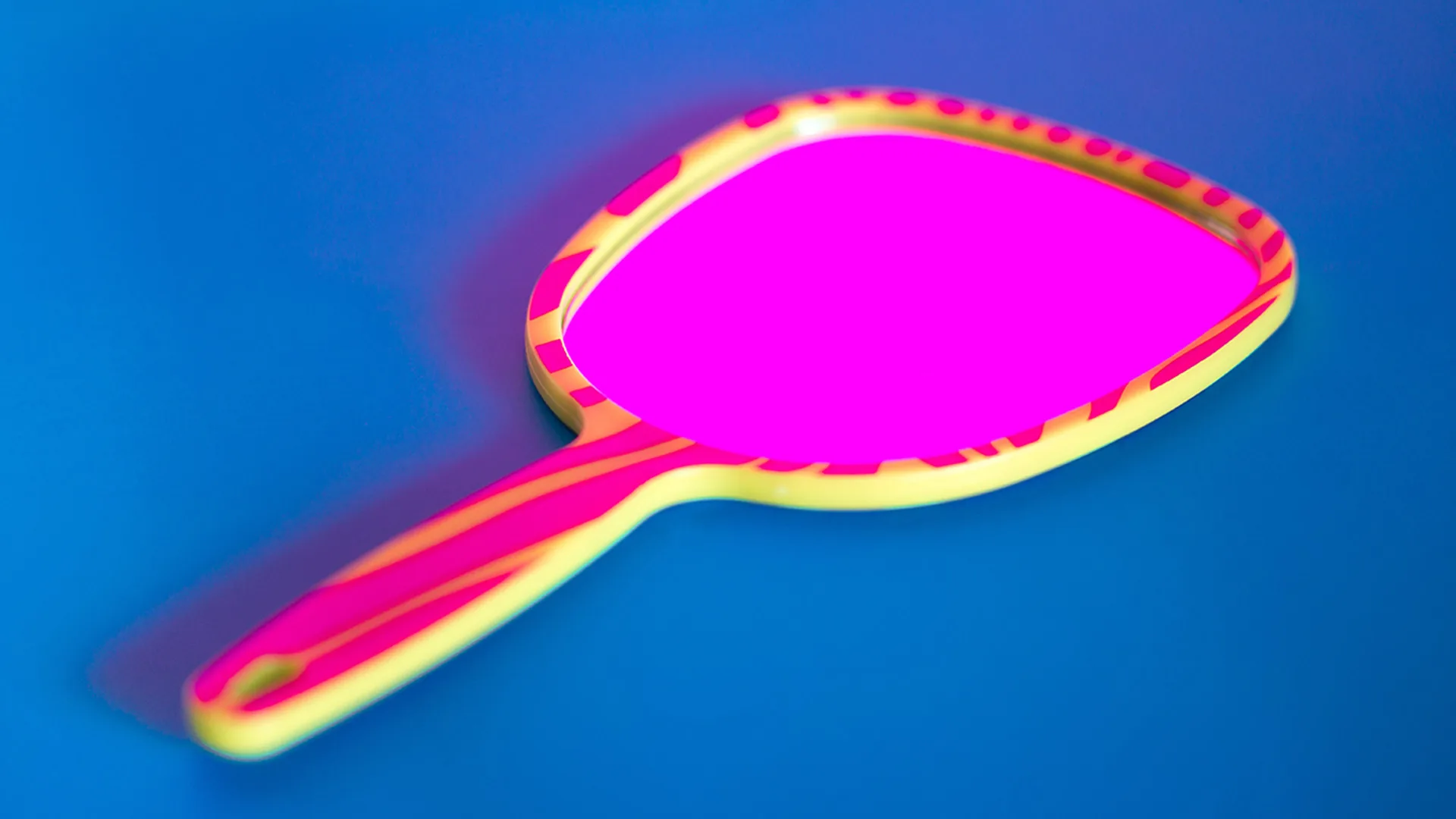 A pink mirror on a blue background