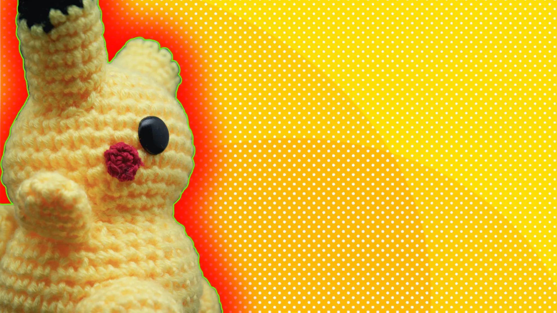 A toy Pokemon teddy with a red glow on a yellow background