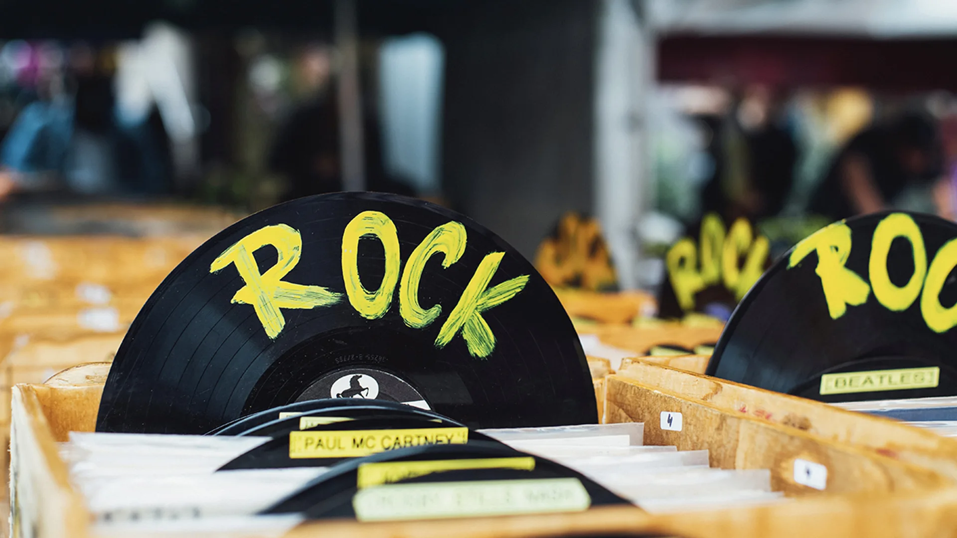A record shop with a record which has Rock written on it in yellow