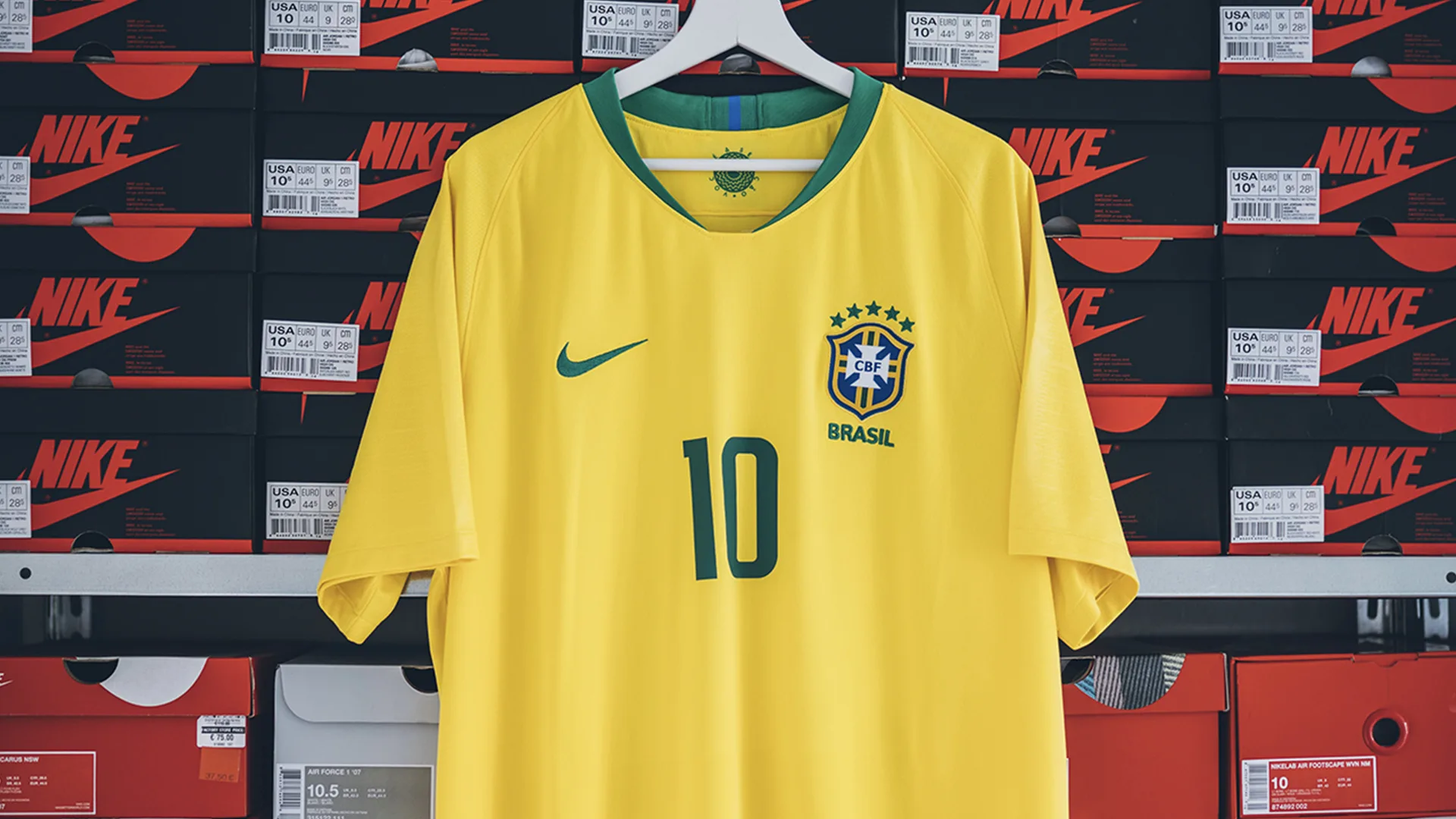 A brazil football shirt in front boxes of trainers