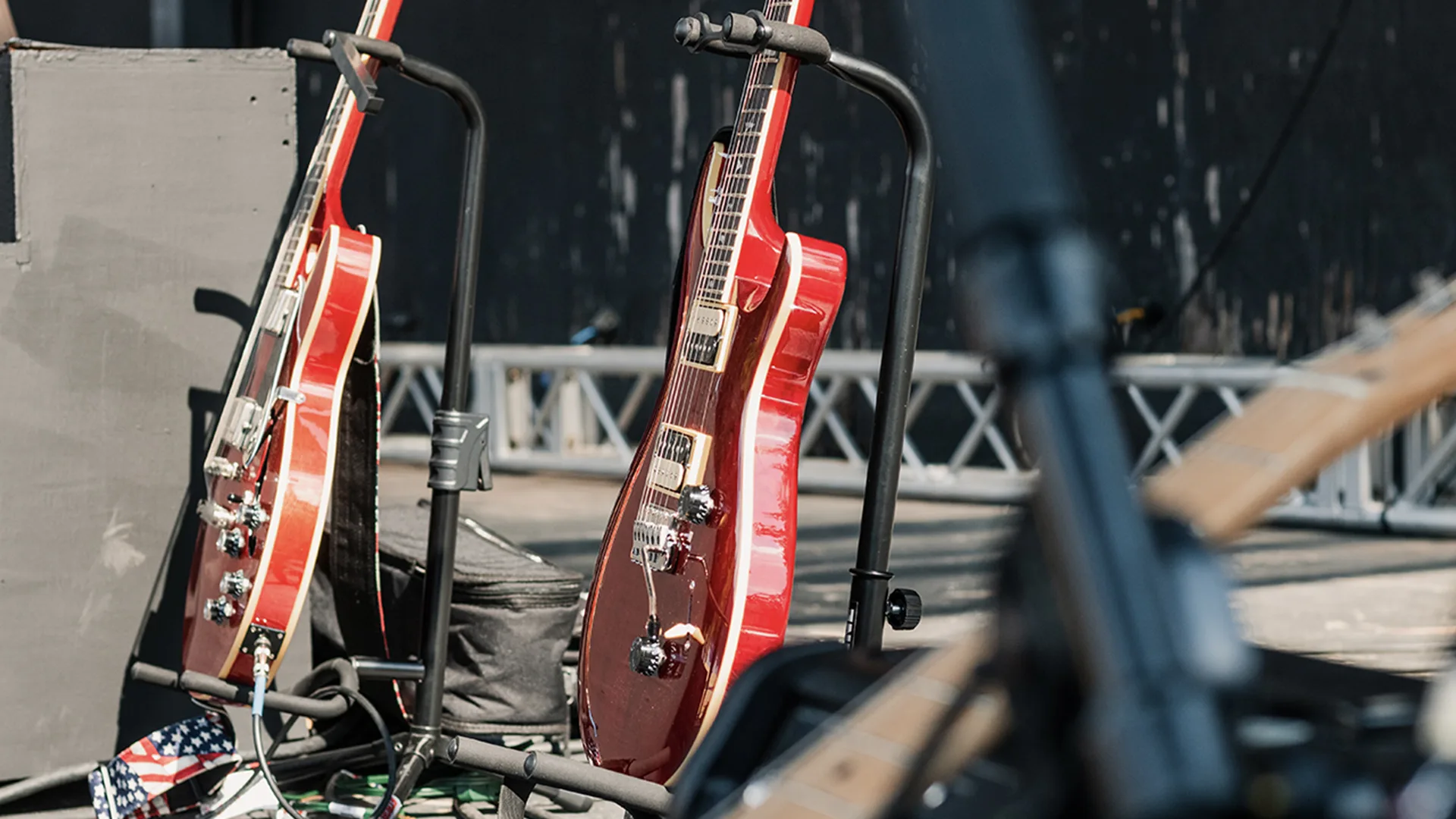 Guitars on stands on stage