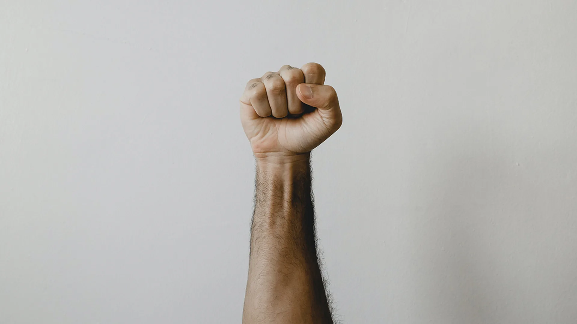 A fist in front of a white background