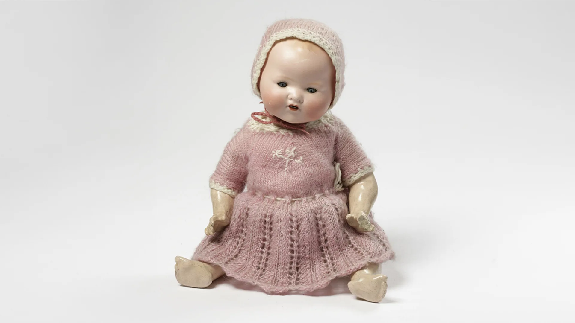 Doll, wearing a pink dress