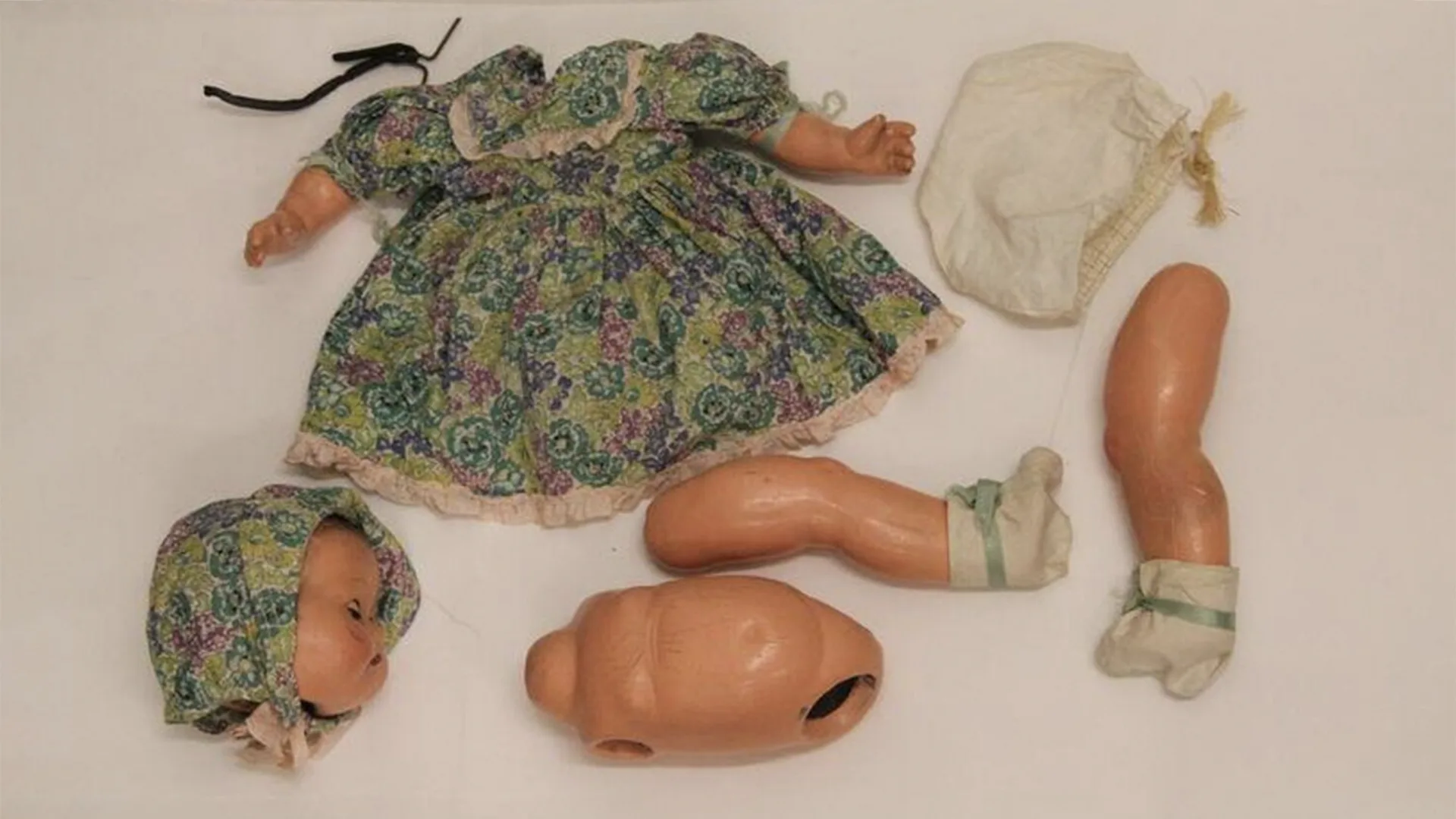 Christine, the doll with their body pieces separated