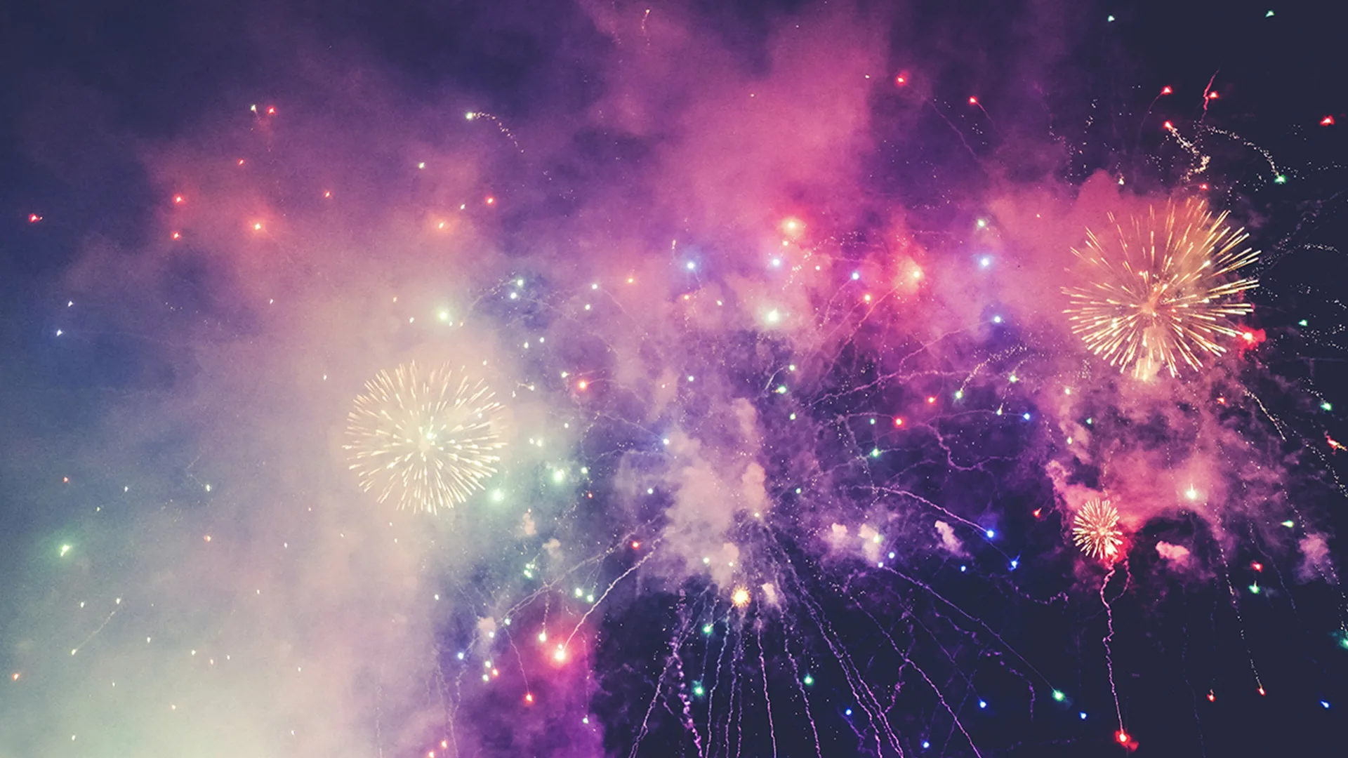 Purple and pink fireworks in the sky