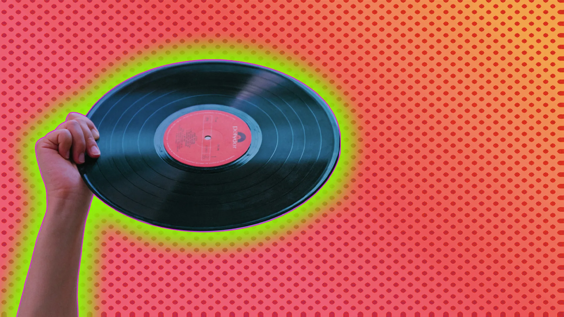 Hand holding vinyl record outlined by light green halo effect on red-dotted background.