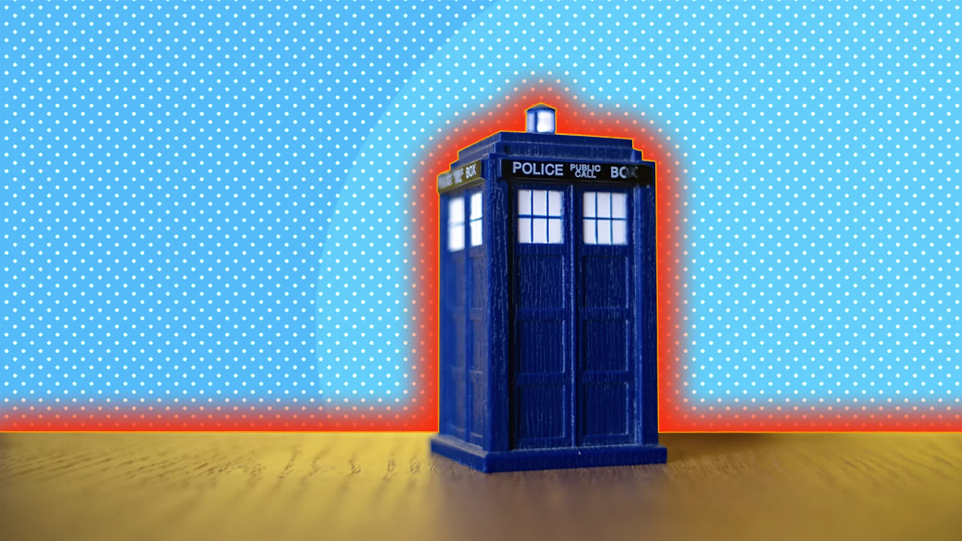 Blue police box tardis against a blue spotty background