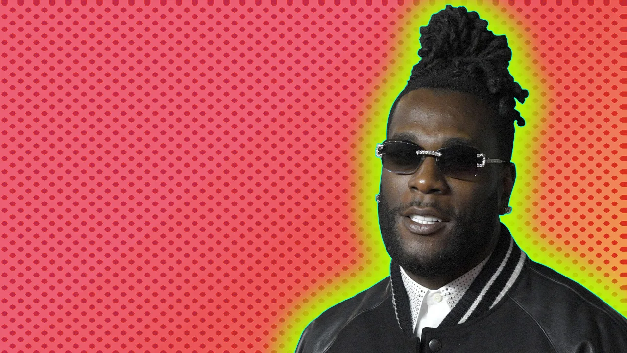 Burna Boy with a green glow on a pink and red background