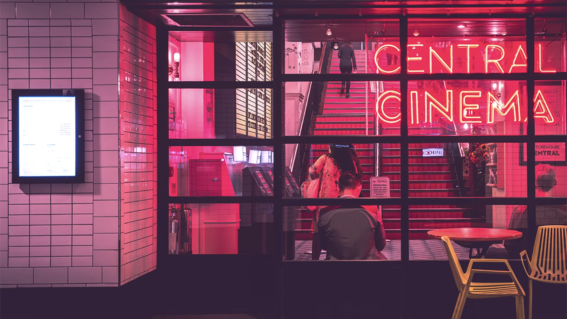 Outside view of a vintage style cinema with neon lighting