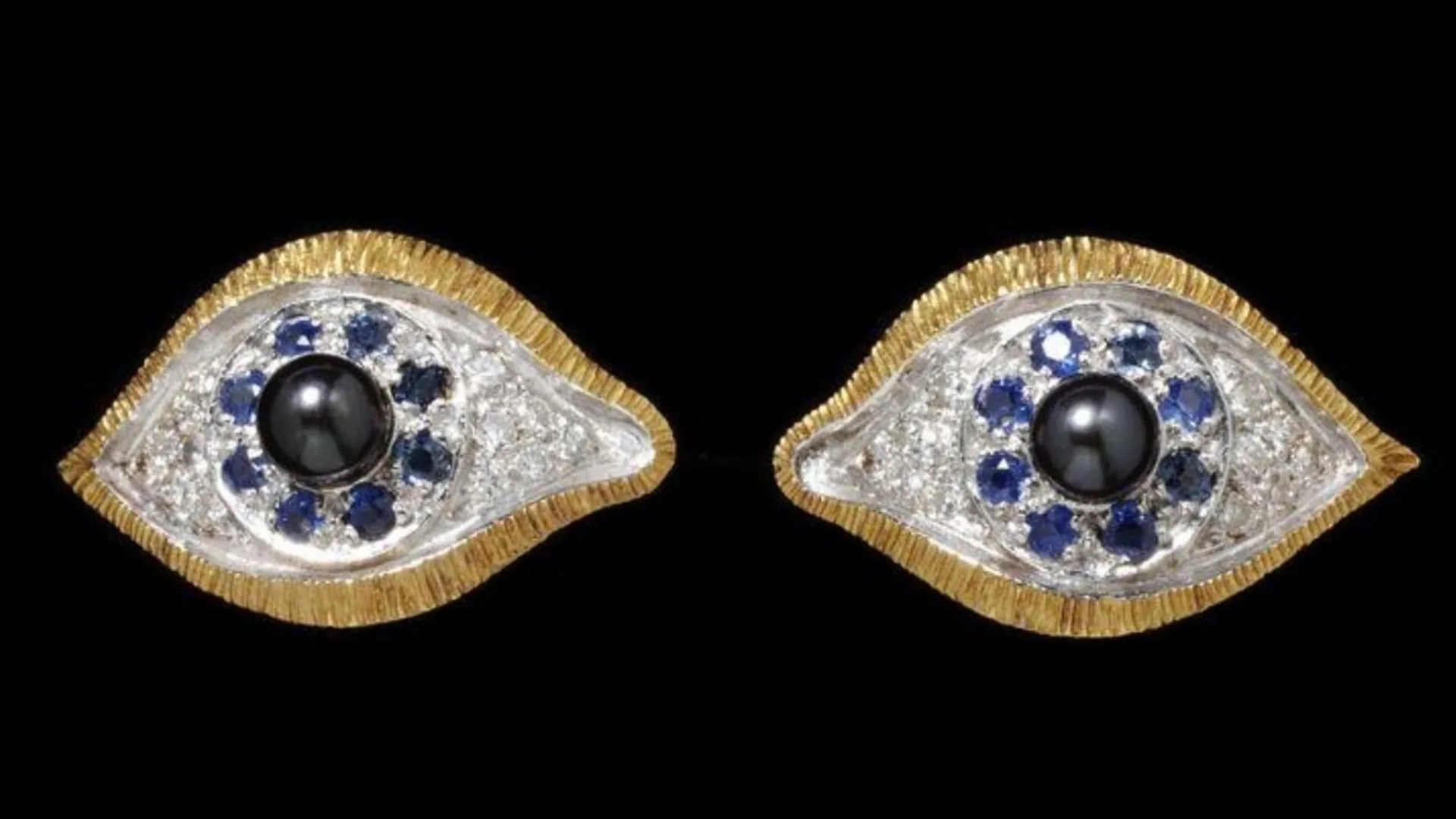 jewelled brooches in the shape of two eyes, with black pearls diamonds and sapphires