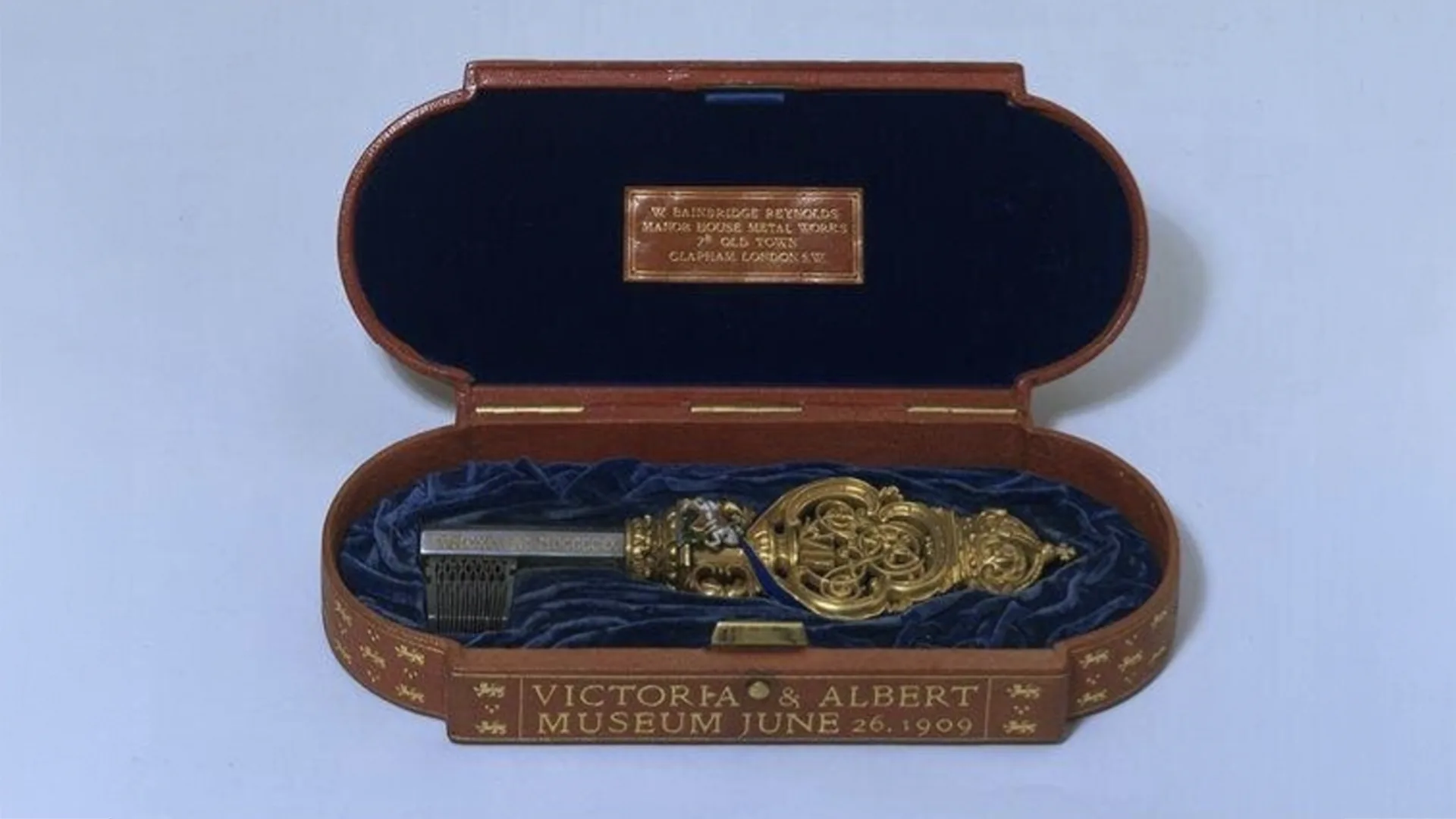 A fancy key in a wooden box