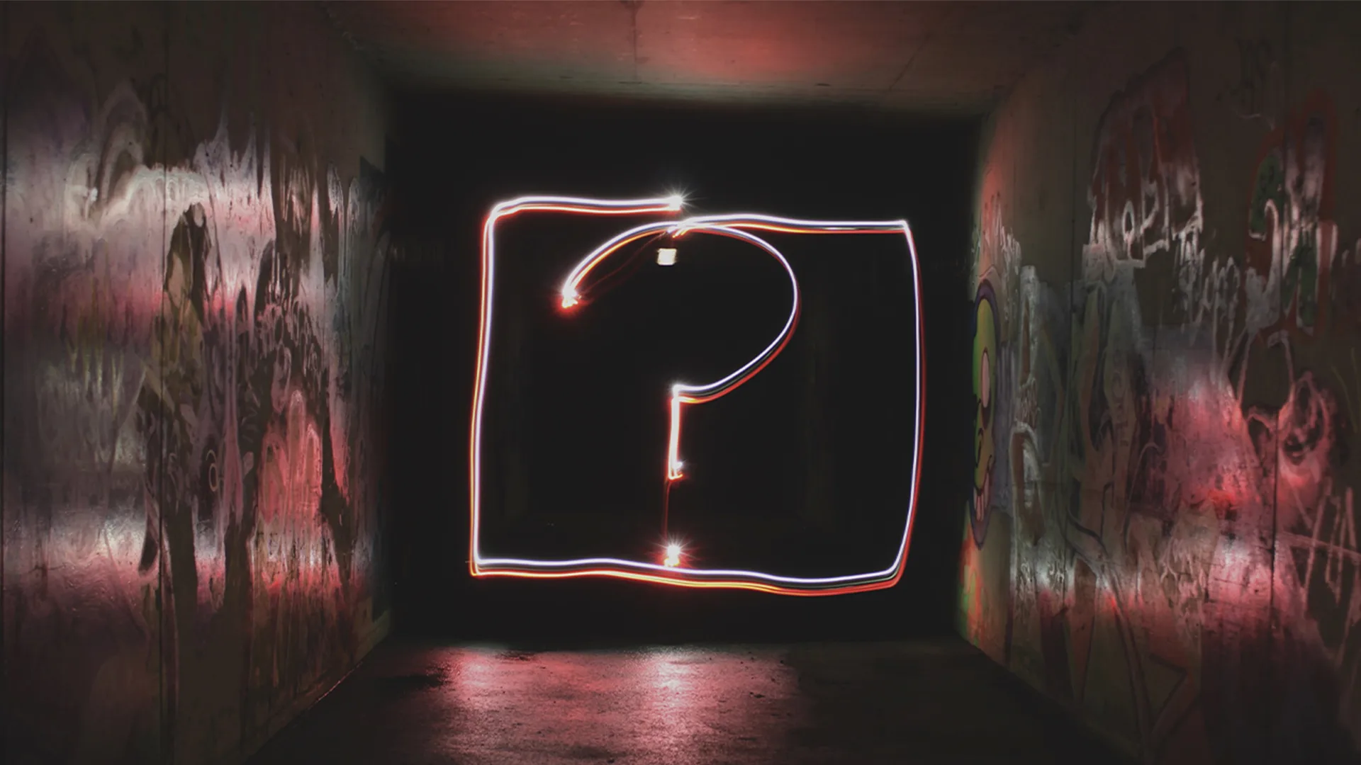 A question mark in neon lights