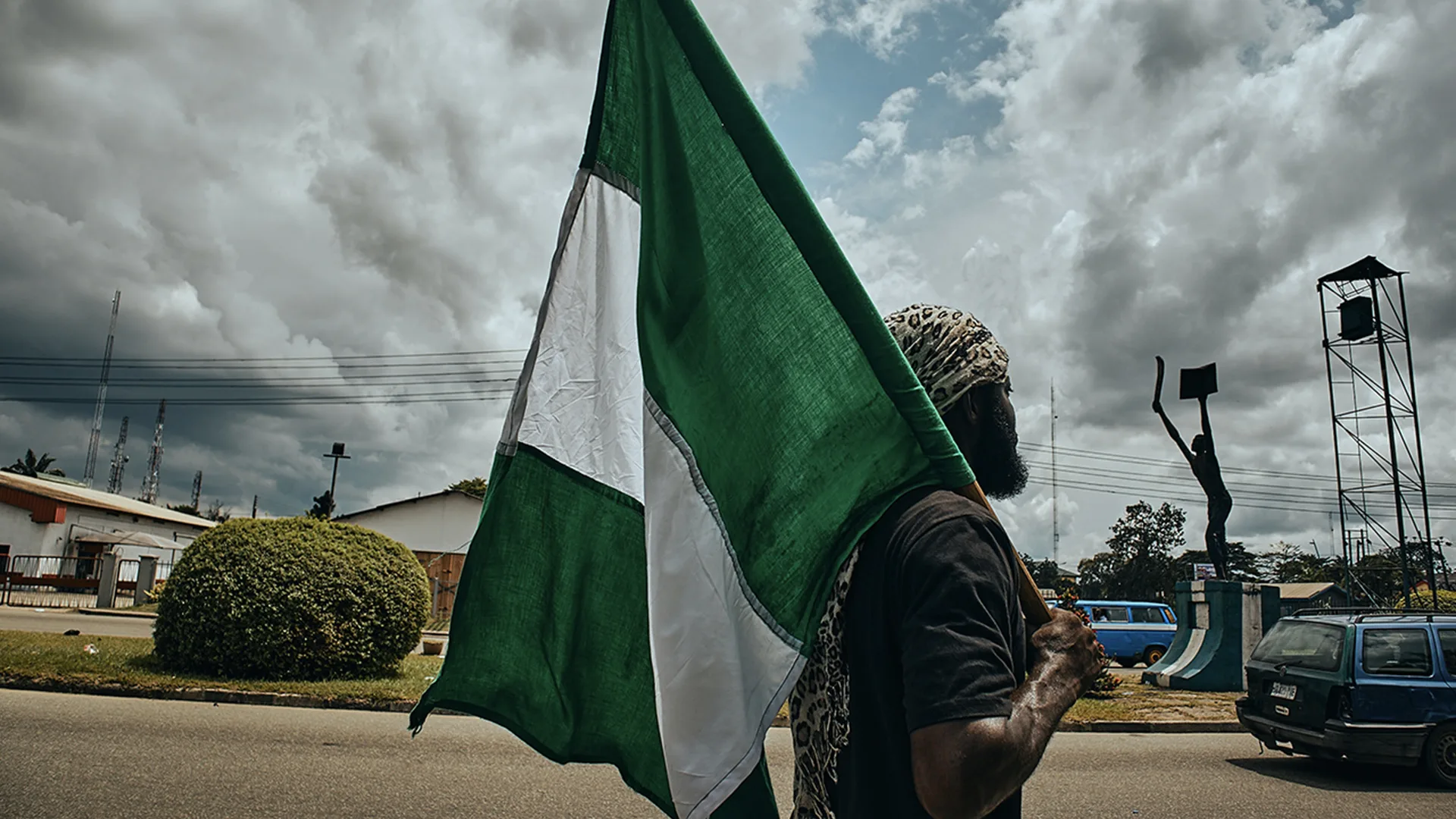 A man holding a Nigerian flag