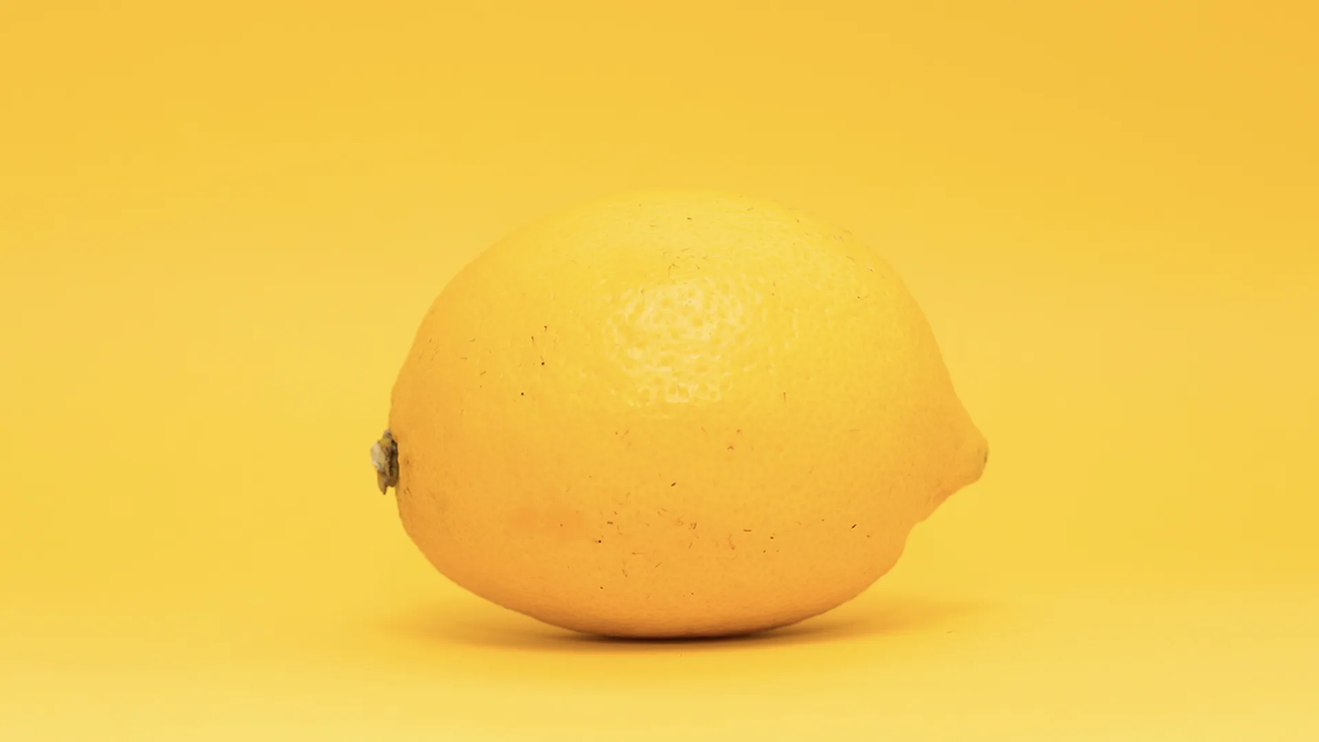 Lemon on yellow background