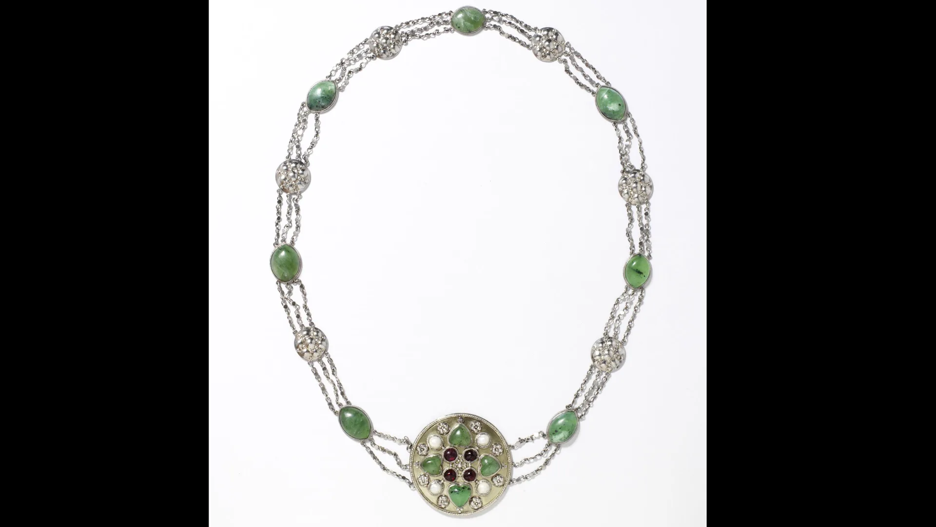A photograph of a silver necklace designed by May Morris