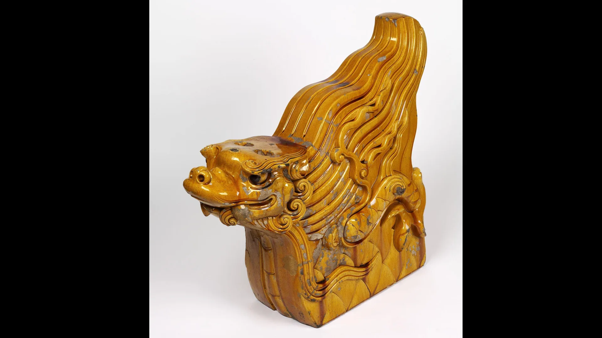 Photograph of a wooden dragon ridge end