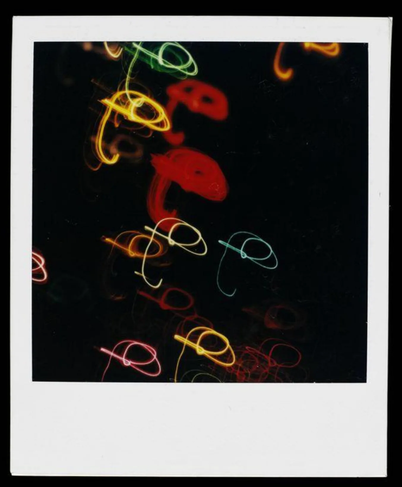 Polaroid photo showing abstract colorful shapes