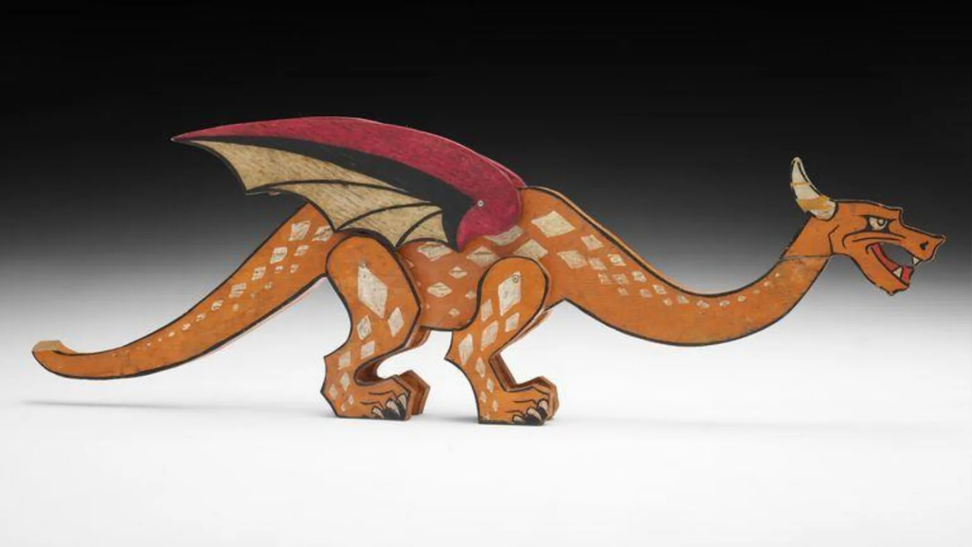 Photograph of a toy wooden dragon
