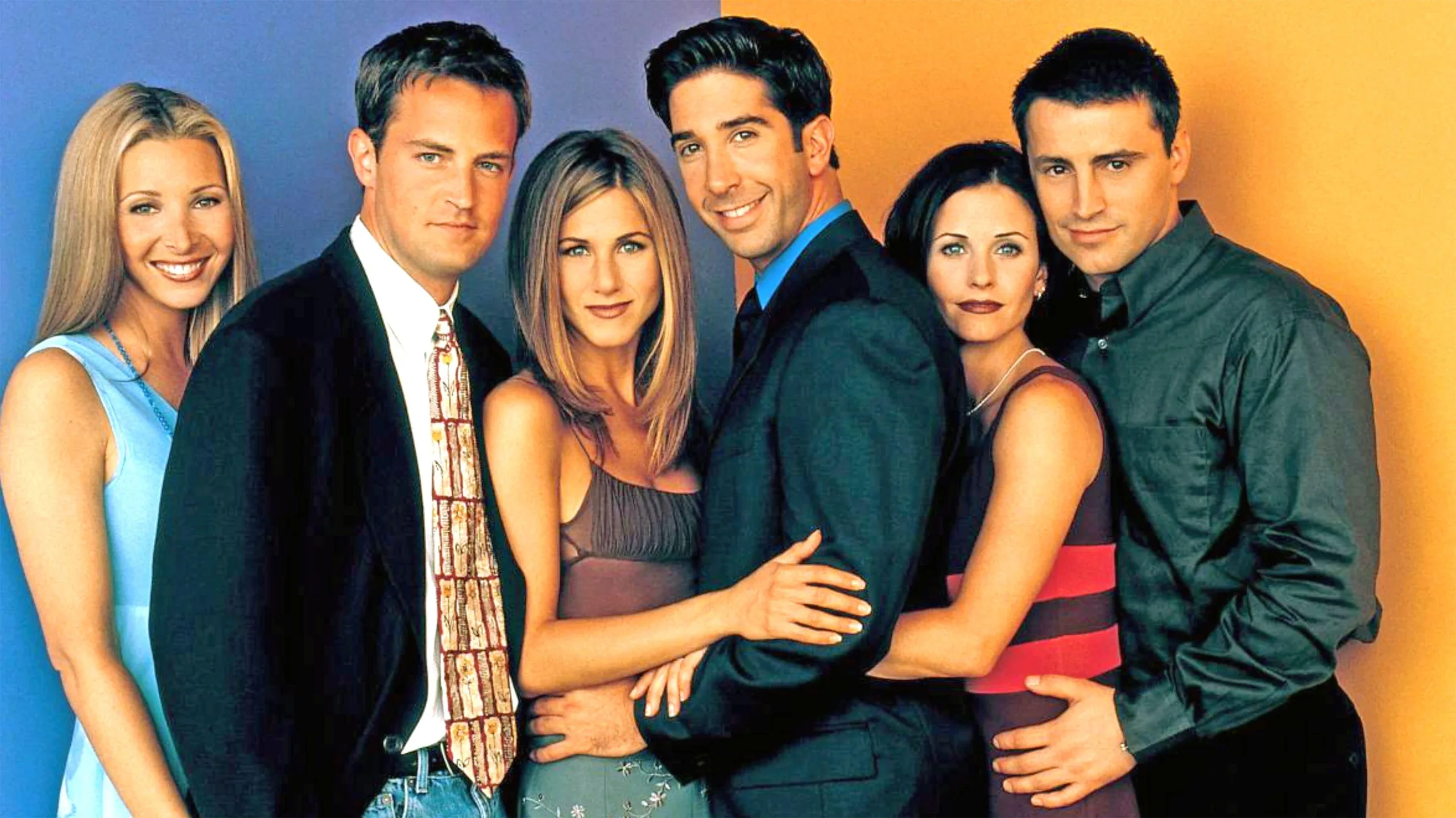 A photograph of the cast of the TV show Friends against a blue and orange background
