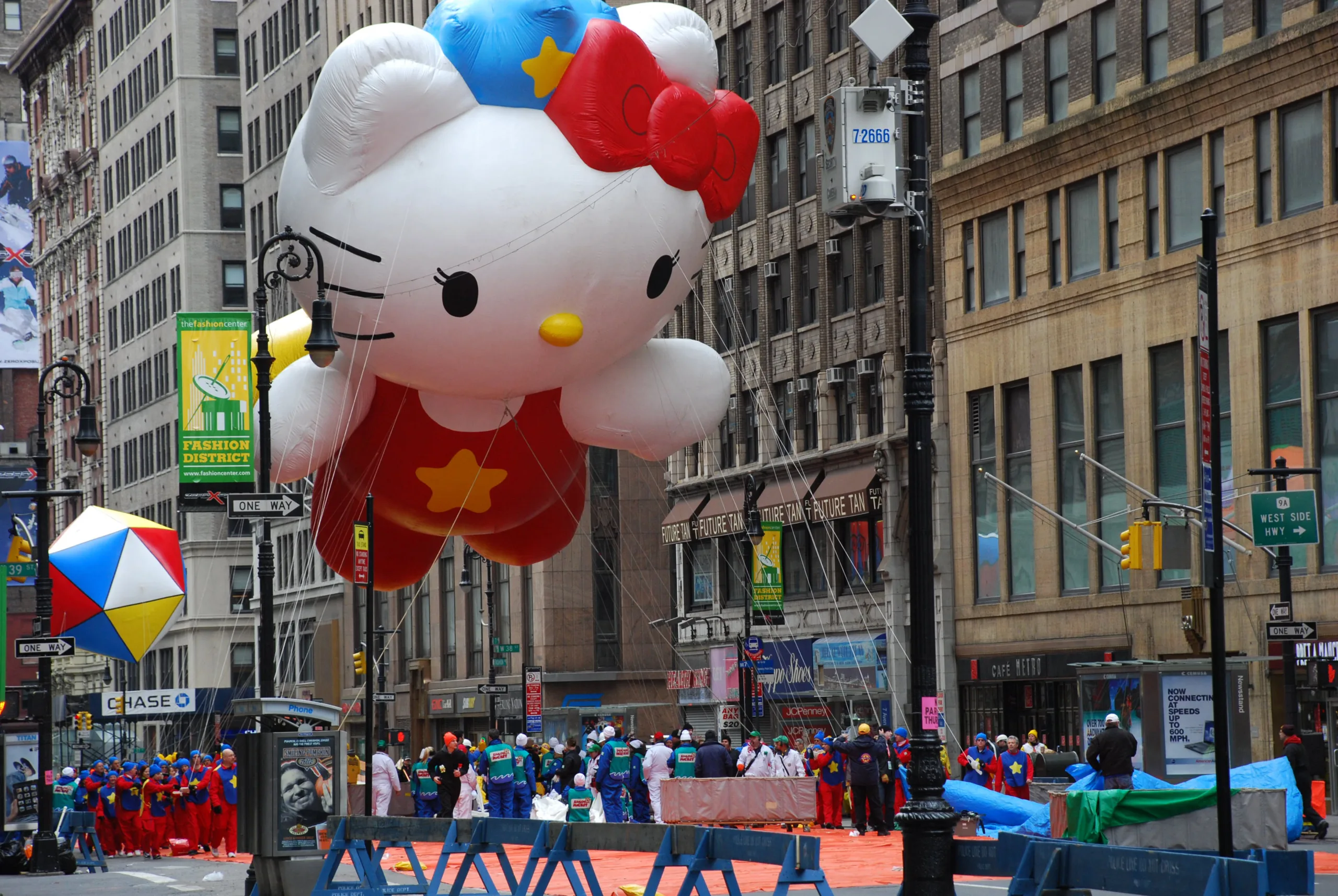 Spectators watching a Hello Kitty balloon at Thanksgiving Day Parade in New York City