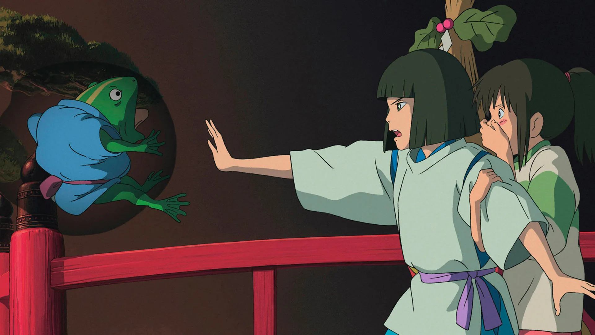 A still from the film Spirited Away showing Haku holding his arm out to put a spell on a toad with Chihiro beside him looking scared