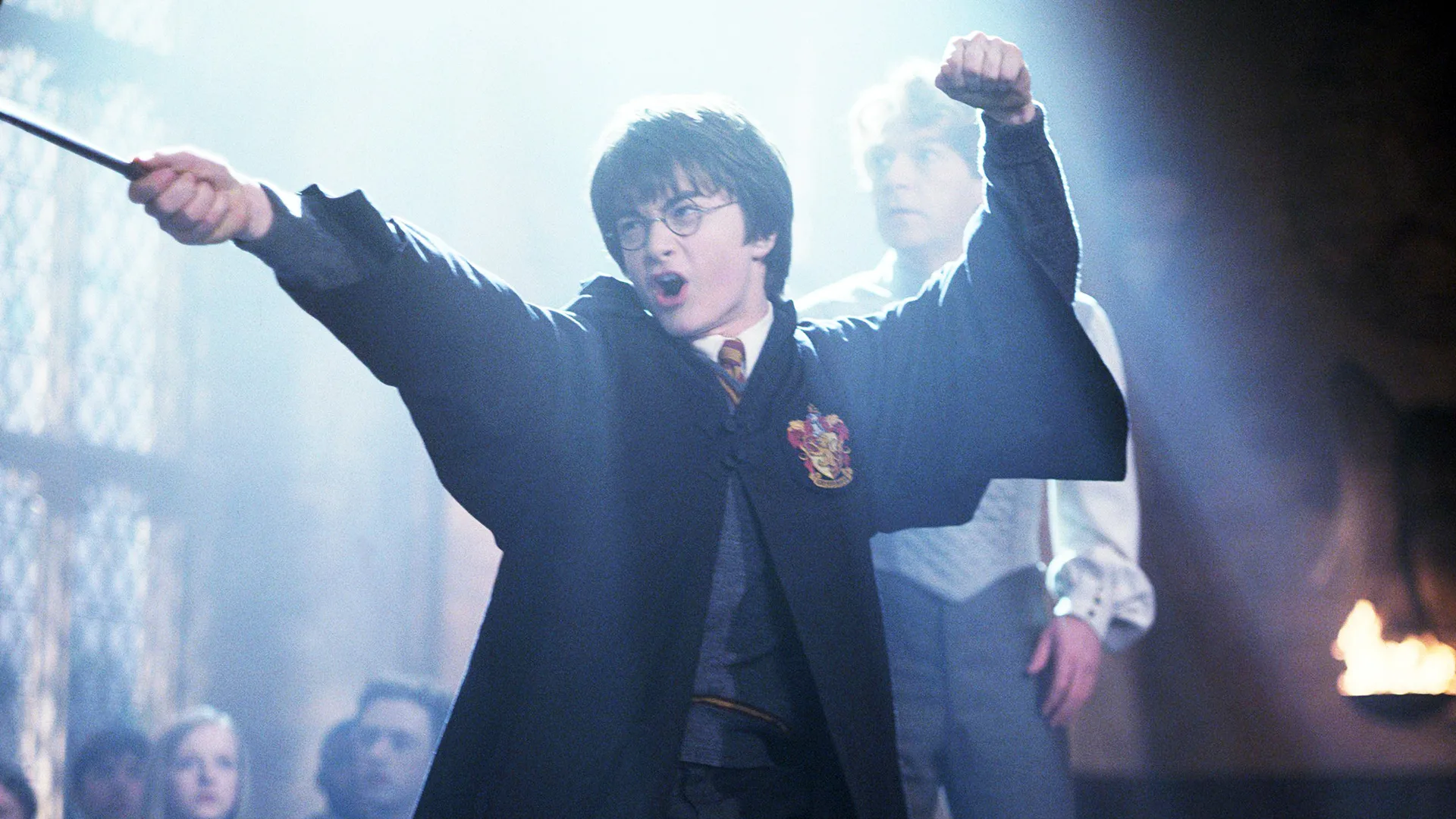 A photograph of Harry Potter casting a spell with light shining down on him