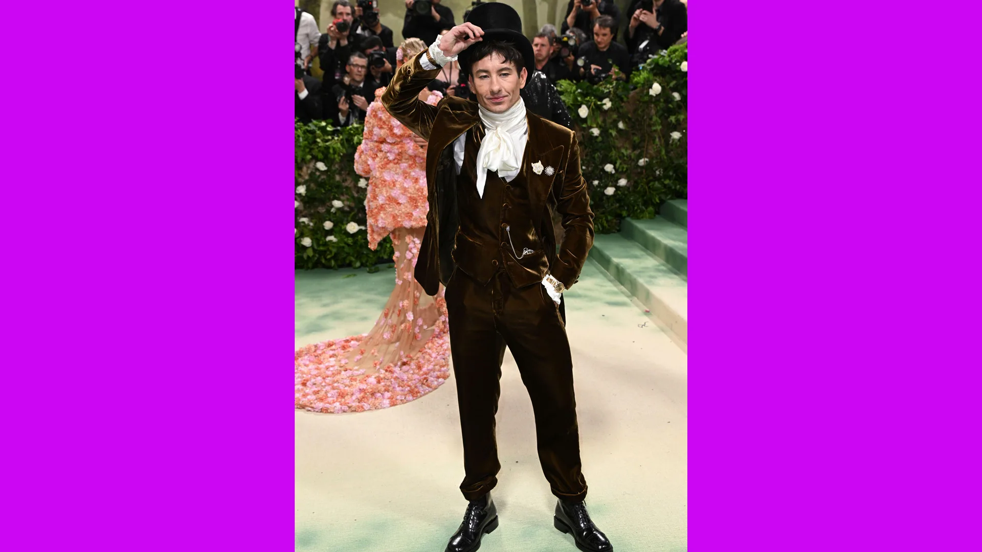 A photograph of Barry Keogan at the Met Gala 2024 wearing a velvet suit with a top hat and neck cravat.