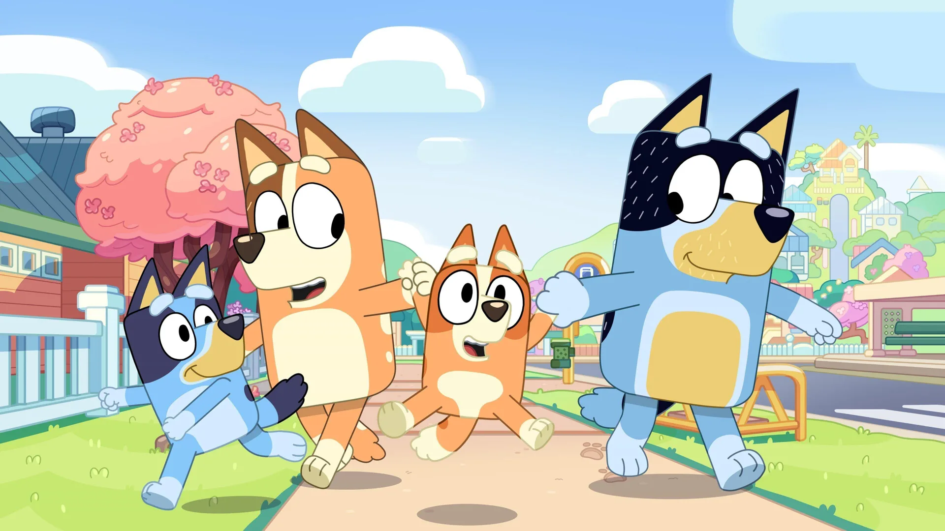 A still from the cartoon Bluey showing the dog family walking down a treelined street, with the dog parents happily swinging Bluey's sibling in the air.