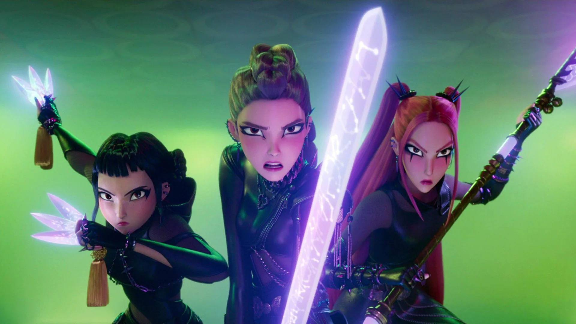 A still from KPop Demon Hunters showing the three female characters in a pose with their neon purple weapons pointed outwards. They are dressed in black against a green background.