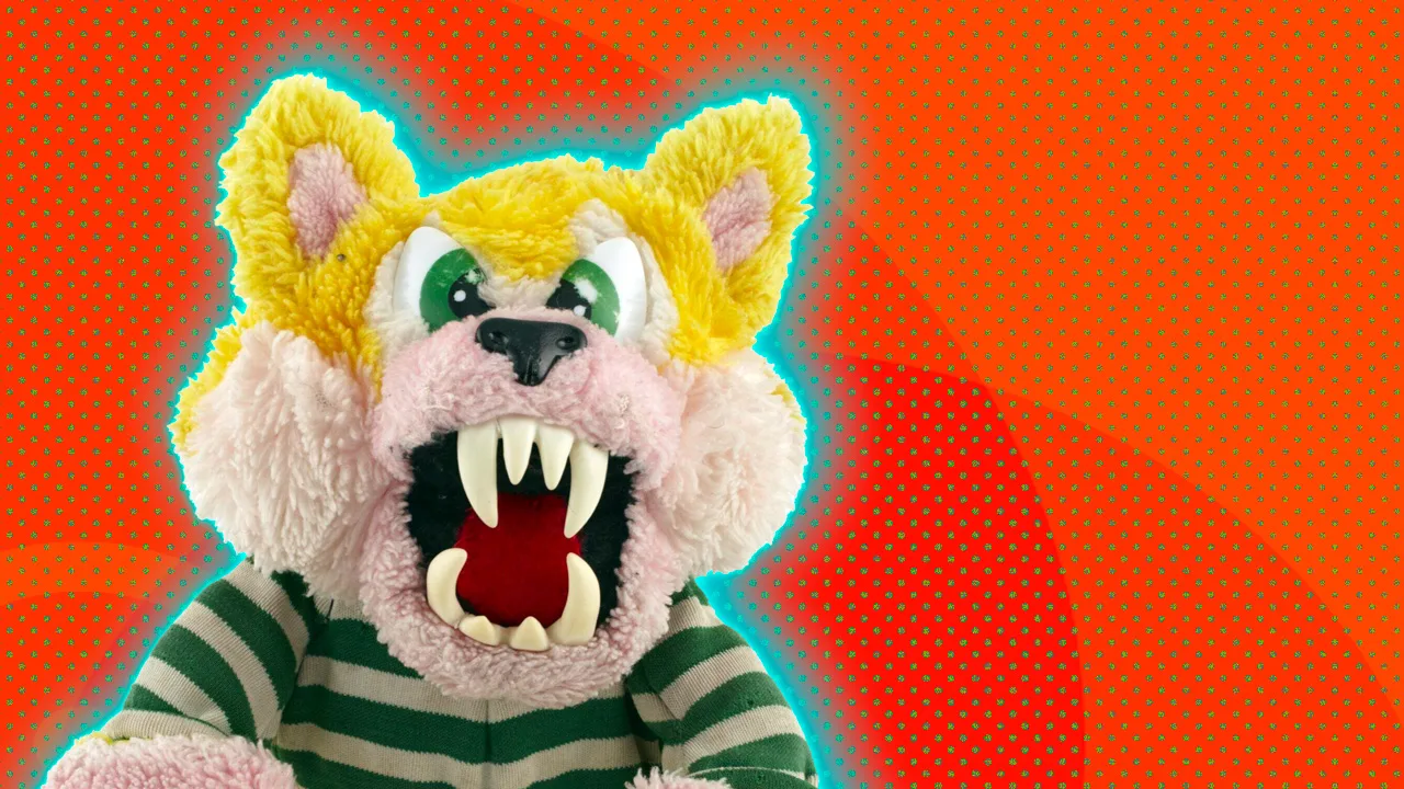 An image of a WereBear with its fangs beared and yellow fur and striped top. It is set against an orange background with a blue halo.