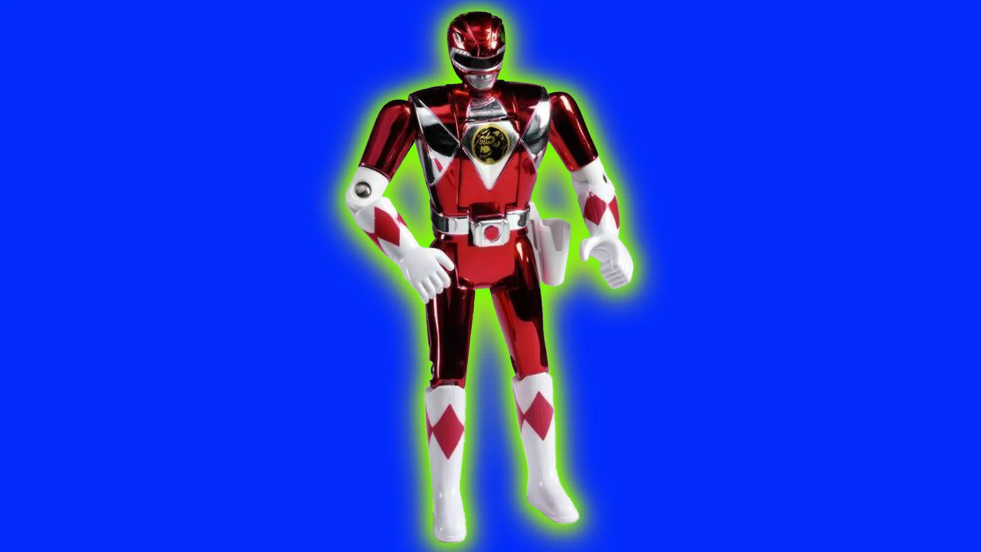 An image of a red power ranger toy posed in a standing position with arms out in front. The toy is stood against a cobalt blue background with a green halo.