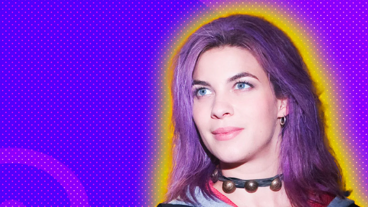 An image of Tonks from Harry Potter with her purple hair and a smile against a purple dotted background and yellow halo.