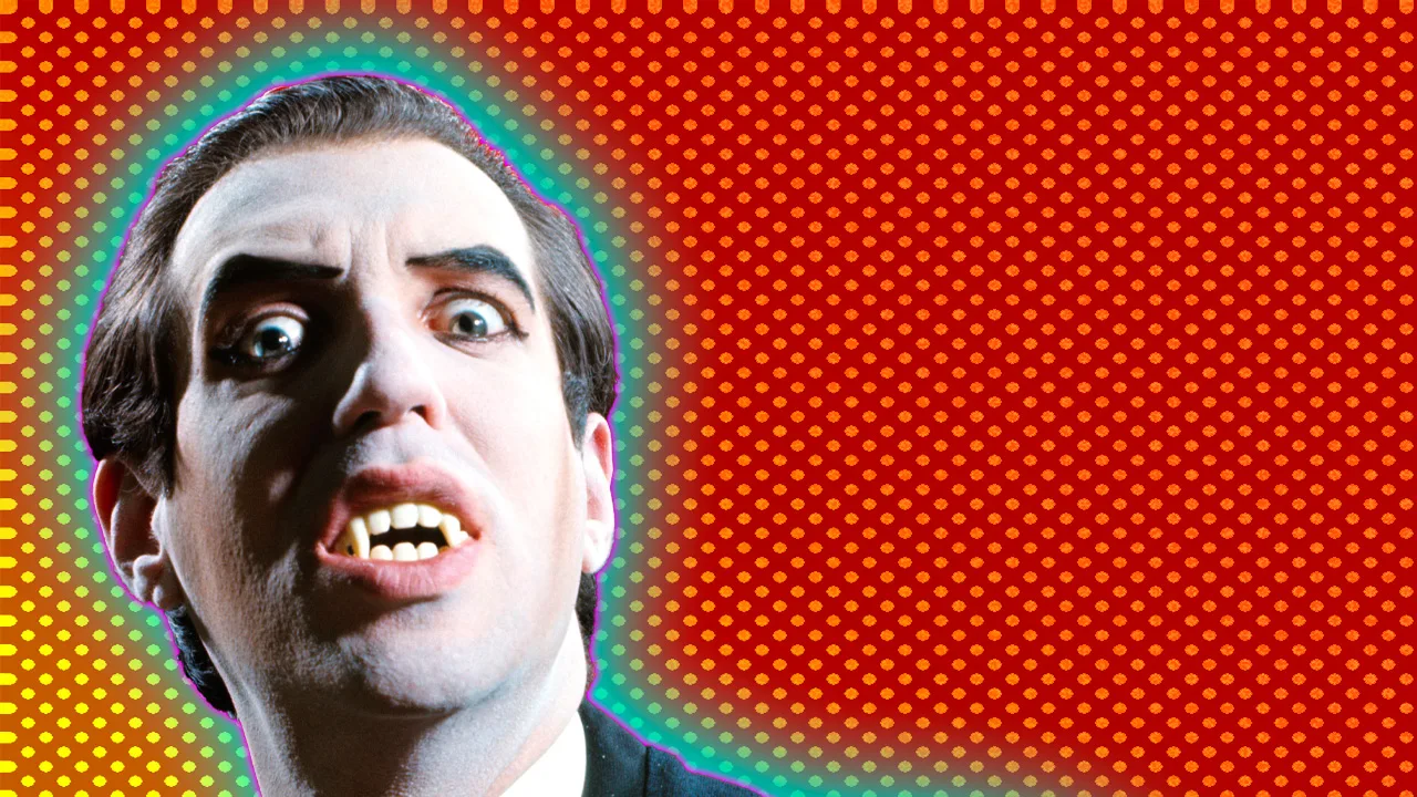 A vampire baring his teeth and looking down directly at the viewer against an orange dotted background with a blue halo.