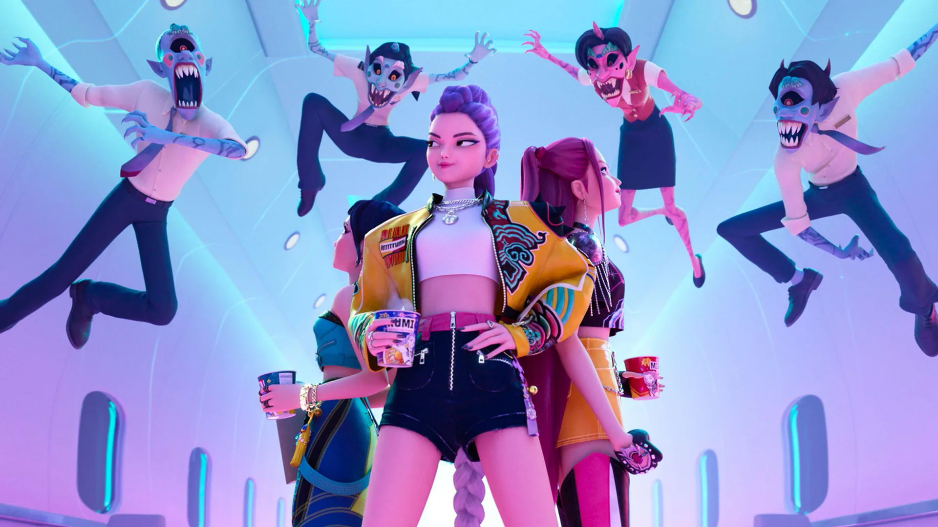 A still from Kpop Demon Hunters showing Rumi stood with hands on hips and the two girls behind her with some demonic boys flying in the air coming toward them with a light background behind them.