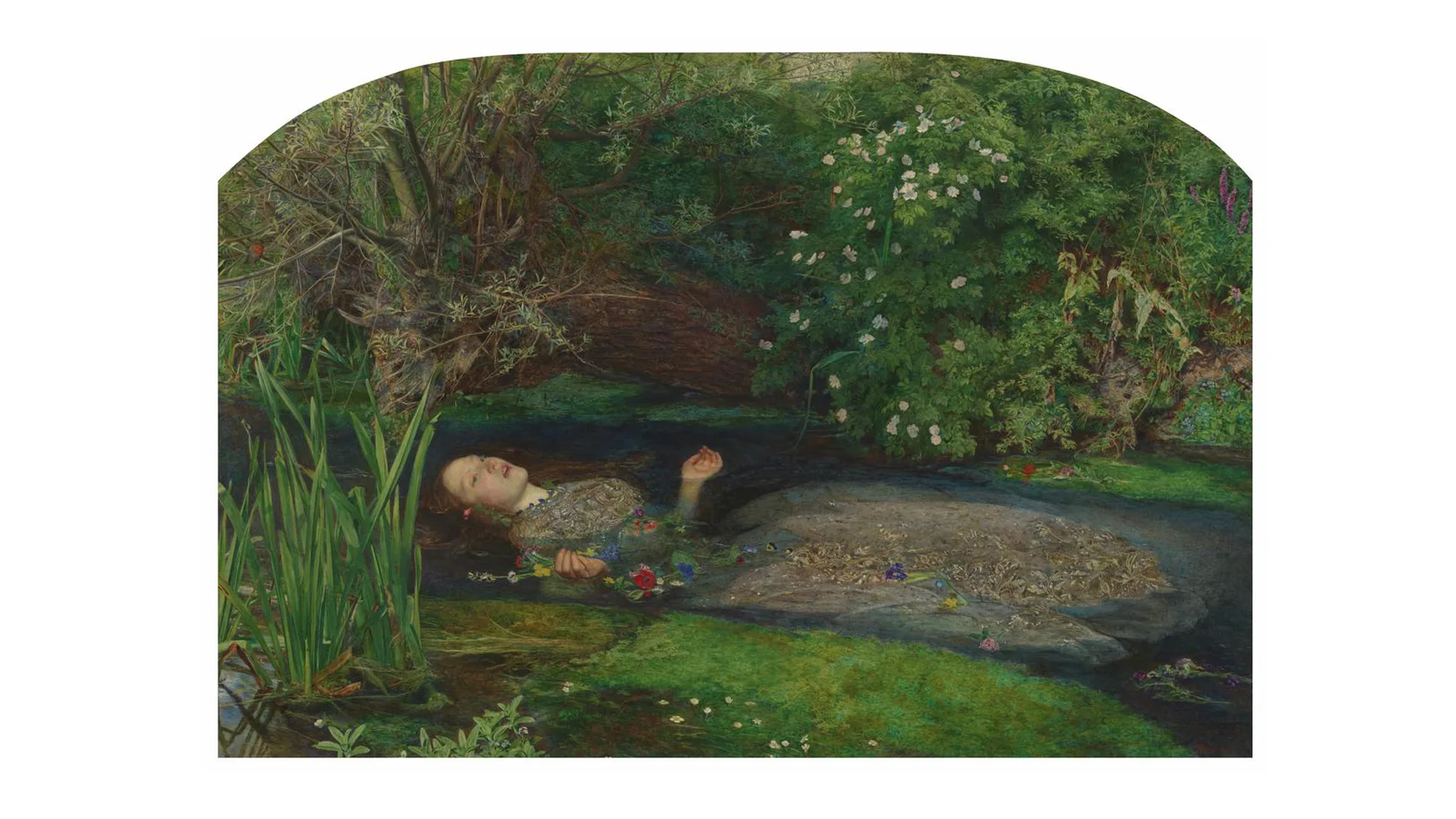 A painting of Ophelia by John Everett Millais depicting a redheaded woman in a large gold gown submerged in a river with her face and hands poking out looking distressed. Around her are bushes and plants with the riverbank either side.