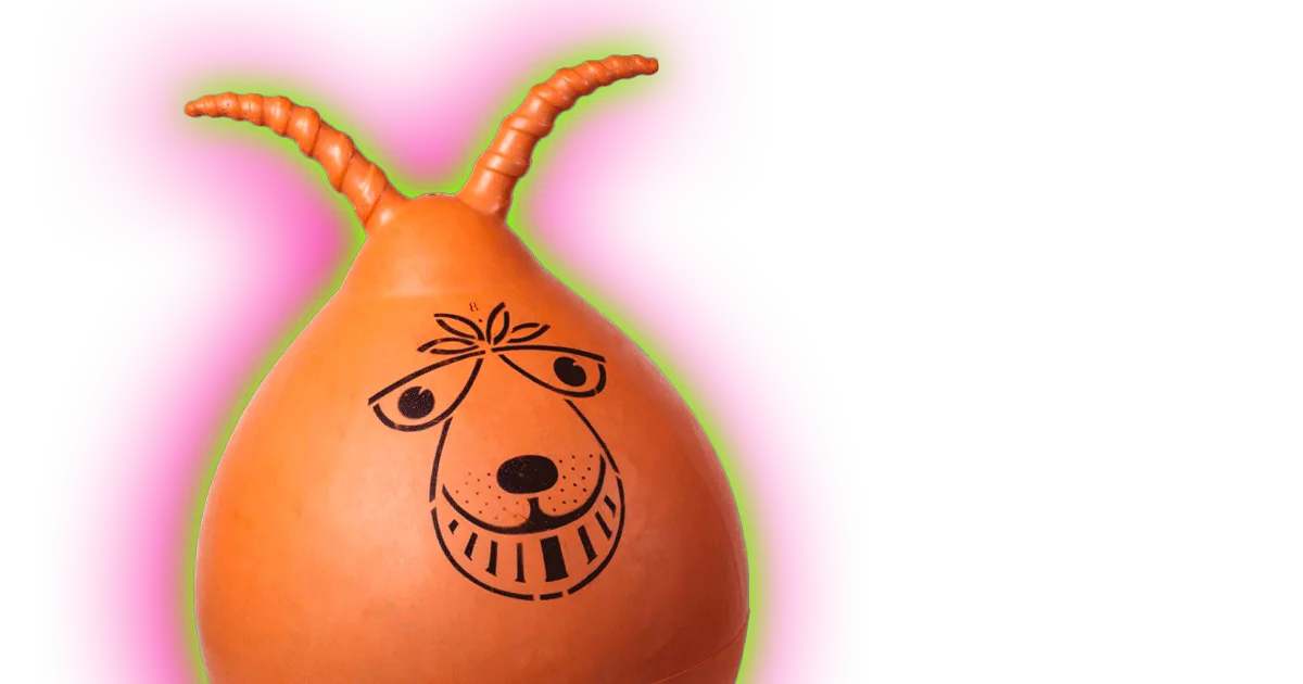 An image of an orange space hopper with a smiling face with a green and pink halo.