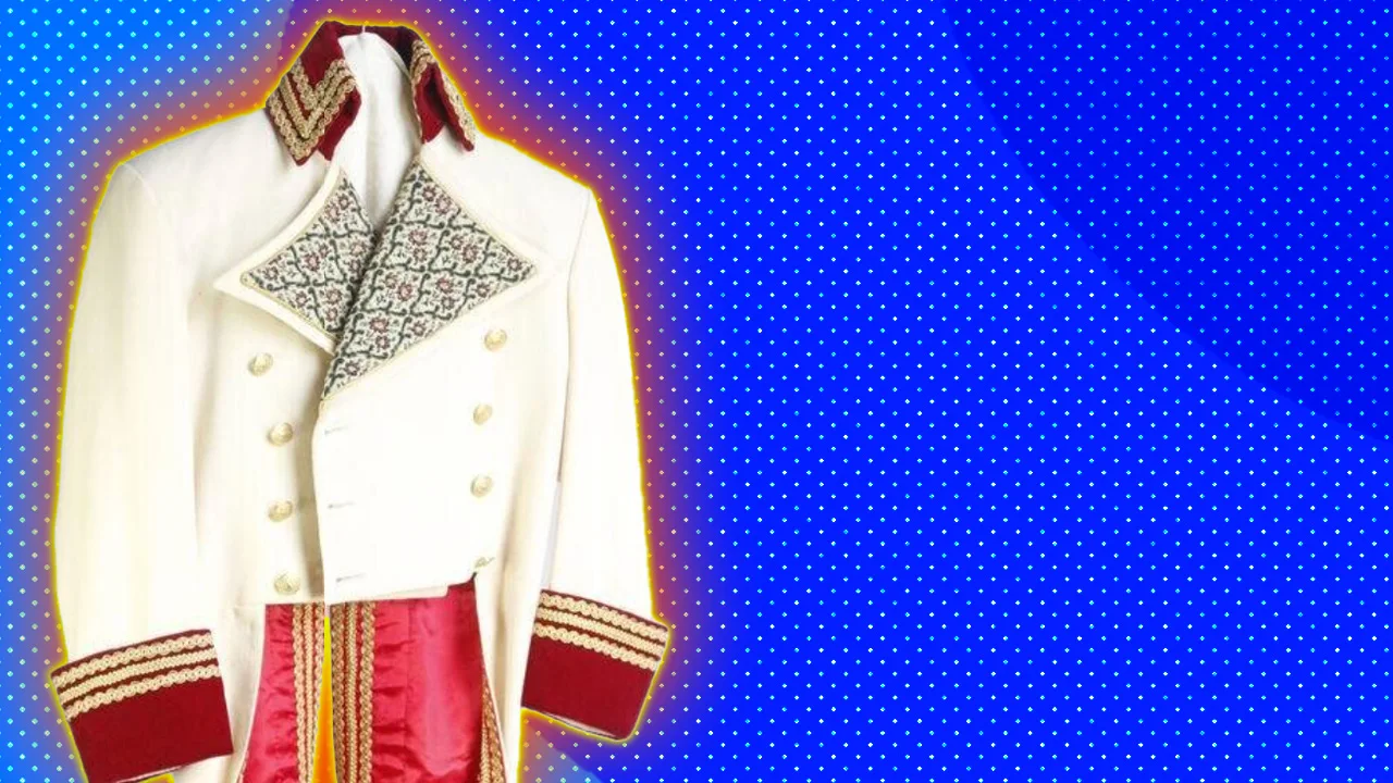 An image of a cream jacket with pattern lapels, gold buttons and red trimmed cuffs and coattails set against a blue dotted background with a red halo.
