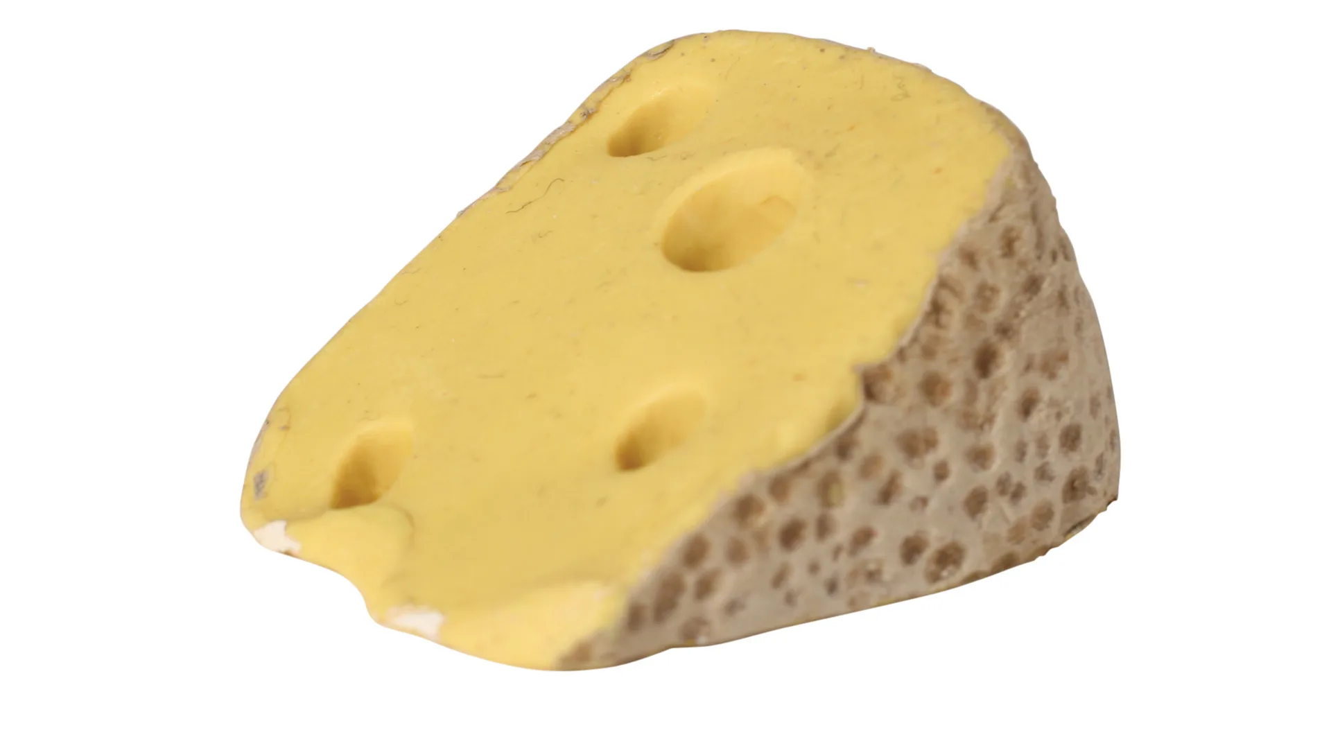 A yellow wedge of cheese prop by Aardman Animation Studios. It has some holes in the cheese and rind. It is set against a white background.