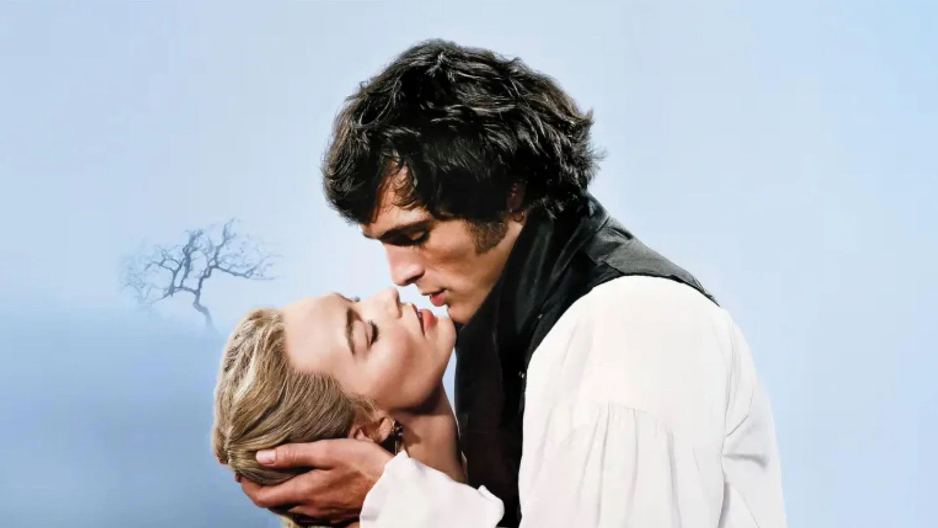 The movie poster for Wuthering Heights (2026) showing Jacob Elordi as Heathcliff holding Margot Robbie as Cathy in his hand looking directly into her face with a grey misty background behind them.