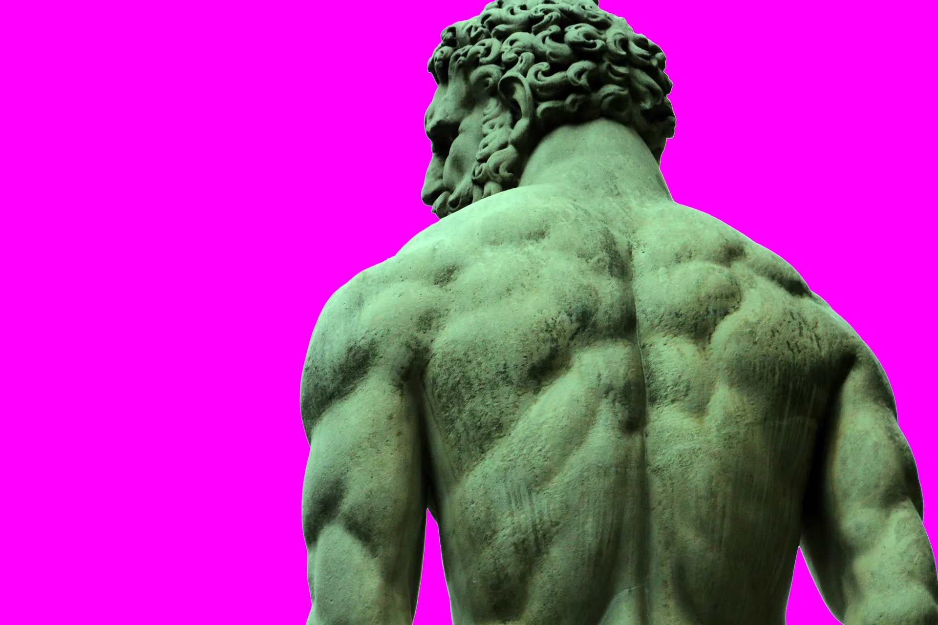 A photo of a statue of Zeus from behind with him looking to the side - he is set against a bright neon pink background.