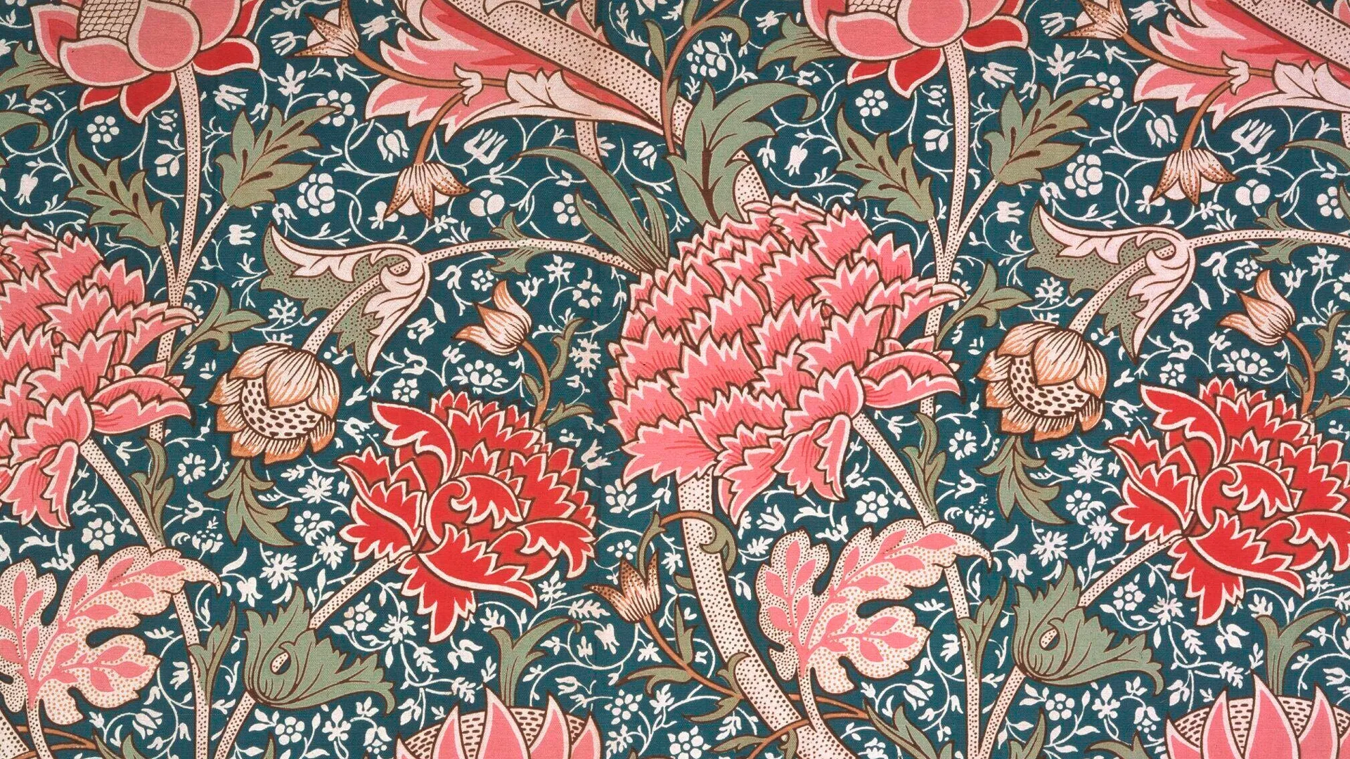A William Morris pattern showing pink and red Chrysanthemums with blue and green leaves and small white flowers.