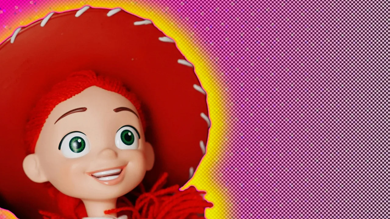 A photo of Jessie from Toy Story looking up smiling with her big red hat on her head set against a pink dotted background with a yellow halo.