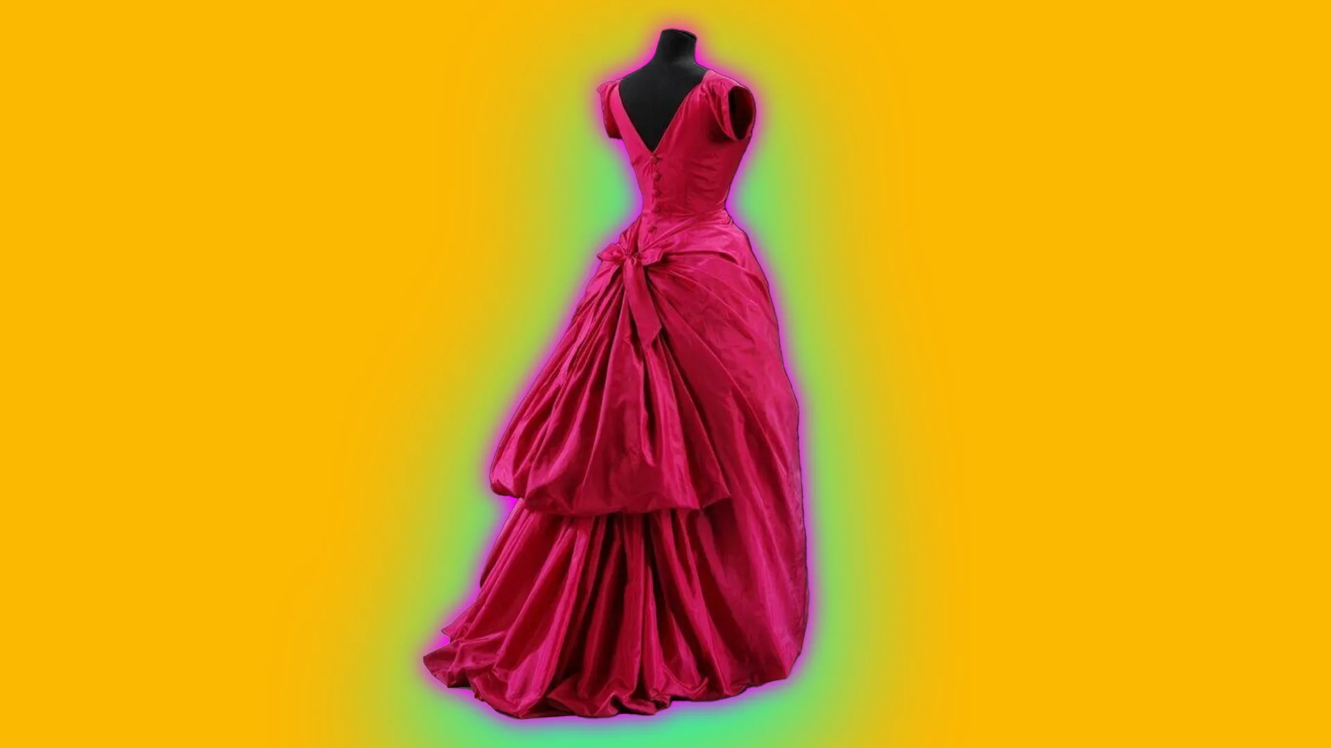 A photo of a bright magenta pink taffeta dress shown from the back with a bustle and v-neck back set against a bright yellow background with a blue halo.